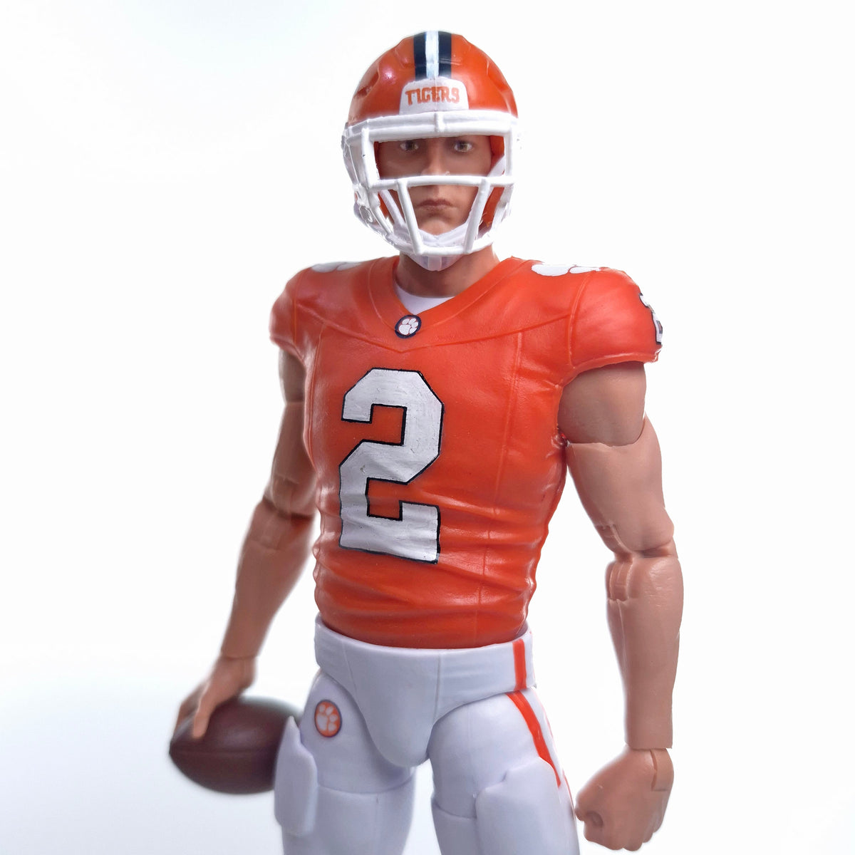 Collegiate Legends Cade Klubnik #2 Clemson action figure wearing an orange jersey and helmet holding a football