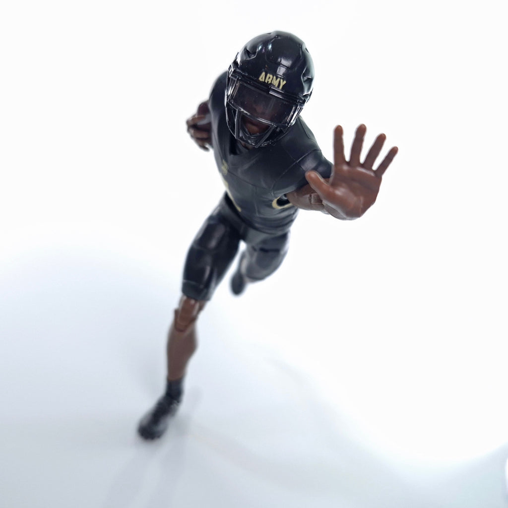 Collegiate Legends Army football action figure in black and gold uniform with helmet in a dynamic running pose