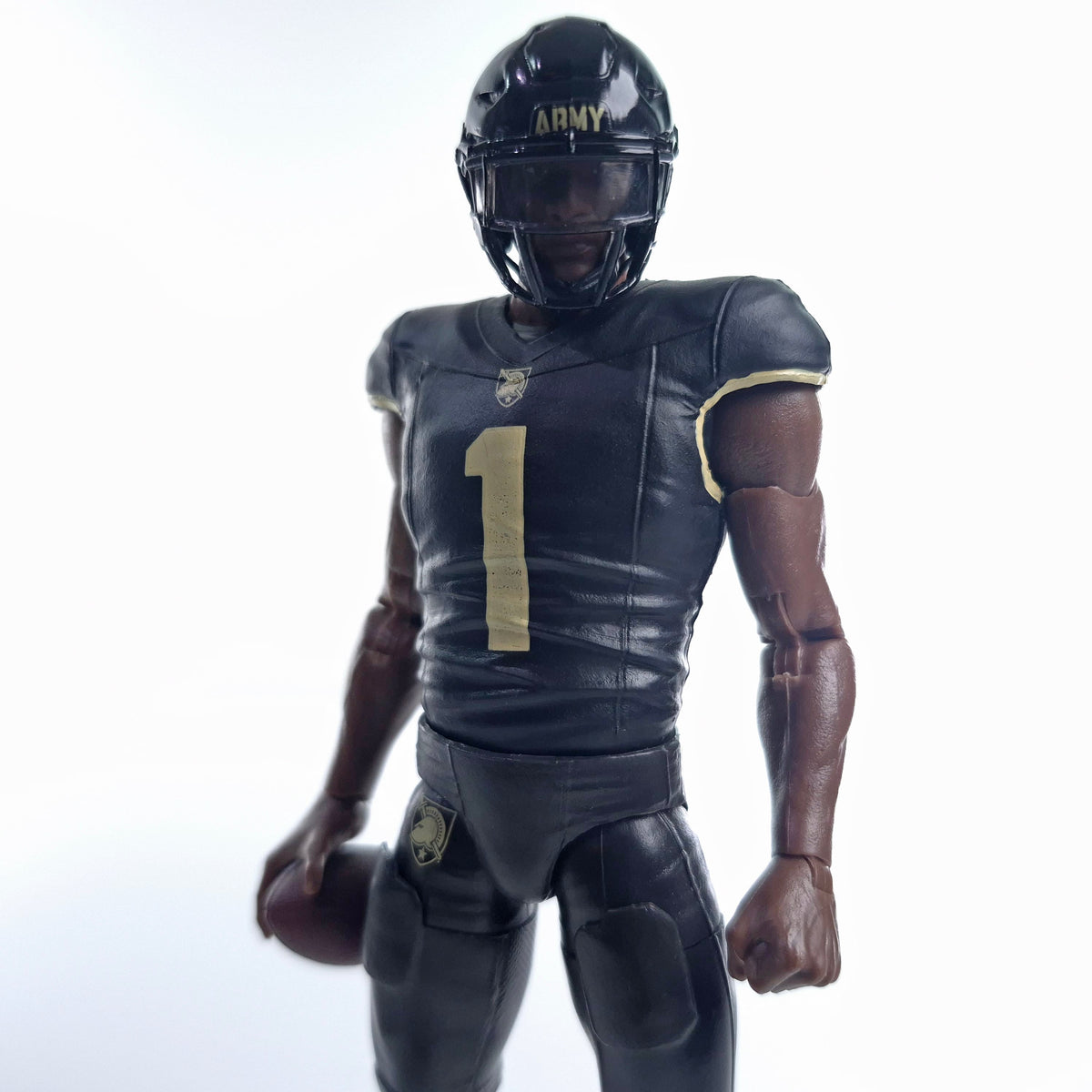 Collegiate Legends 6-inch Army football action figure wearing a black and gold #1 jersey and helmet holding a football