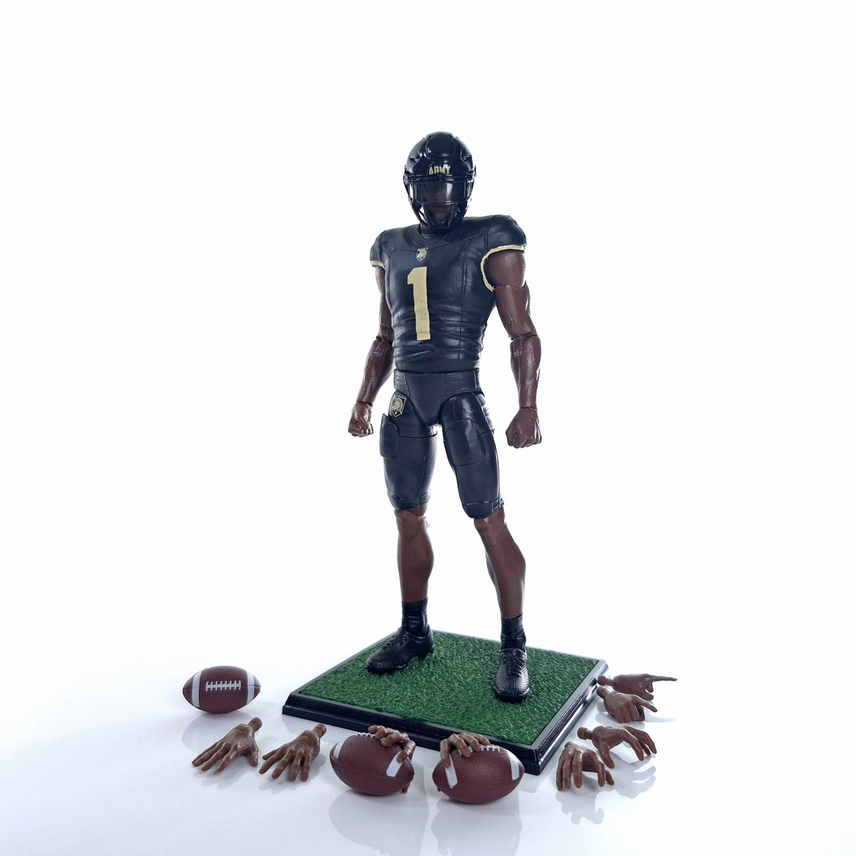 Collegiate Legends Army football action figure in black and gold uniform with display stand, footballs, and hand sets.
