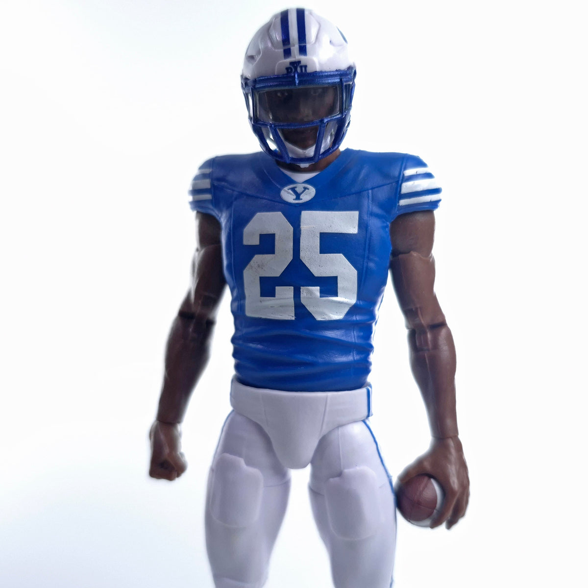Collegiate Legends BYU football action figure number 25 wearing a blue and white uniform with a helmet and football