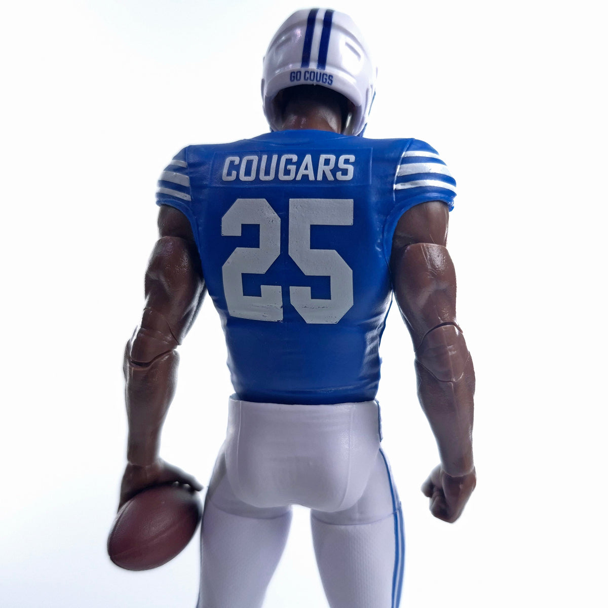 Collegiate Legends BYU #25 football action figure in blue and white uniform seen from the back holding a football