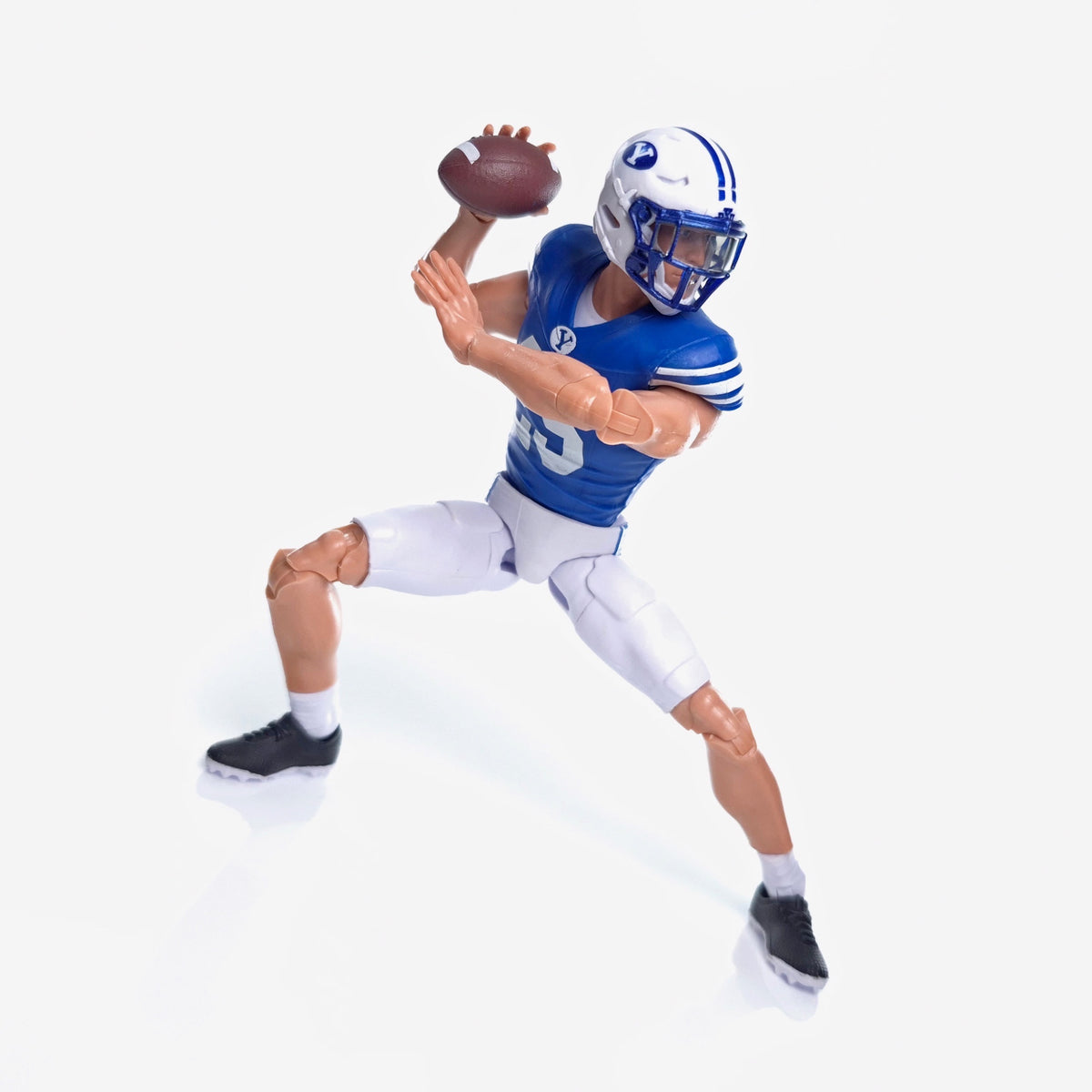 Collegiate Legends #25 BYU football action figure in blue and white uniform throwing a football in a dynamic pose