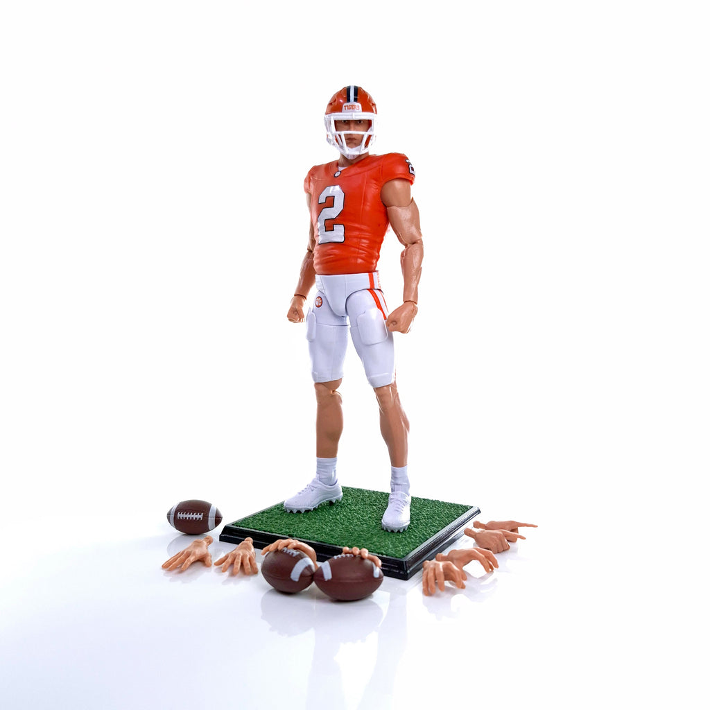 Collegiate Legends Cade Klubnik #2 Clemson action figure with football, display stand, and interchangeable hand sets.