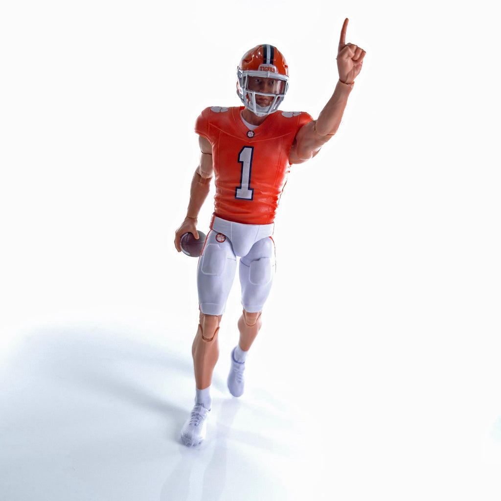 Collegiate Legends Clemson football action figure wearing orange jersey number 1, pointing up with a football