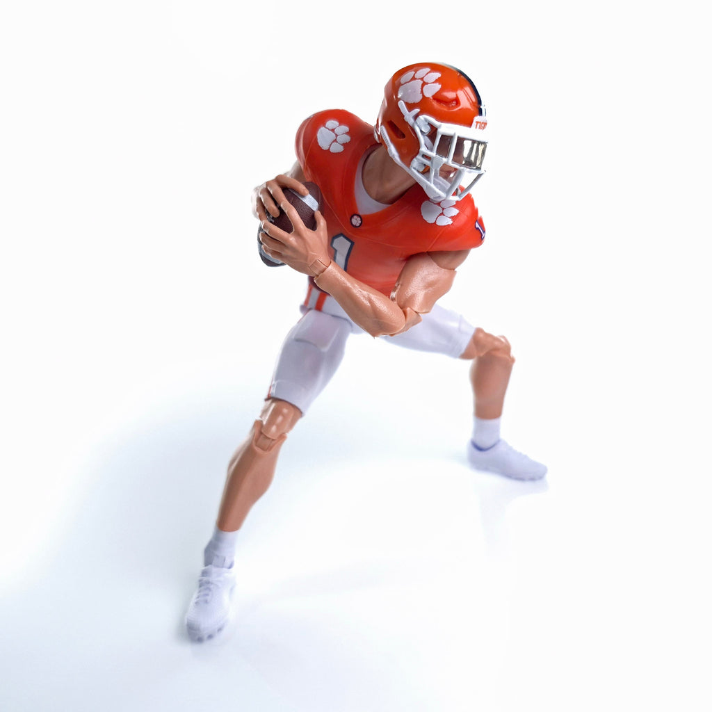 Collegiate Legends Clemson football action figure in orange jersey and helmet holding a football in a dynamic pose