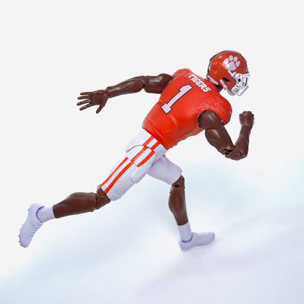 Collegiate Legends Clemson football action figure in orange #1 jersey running in a dynamic pose on white background