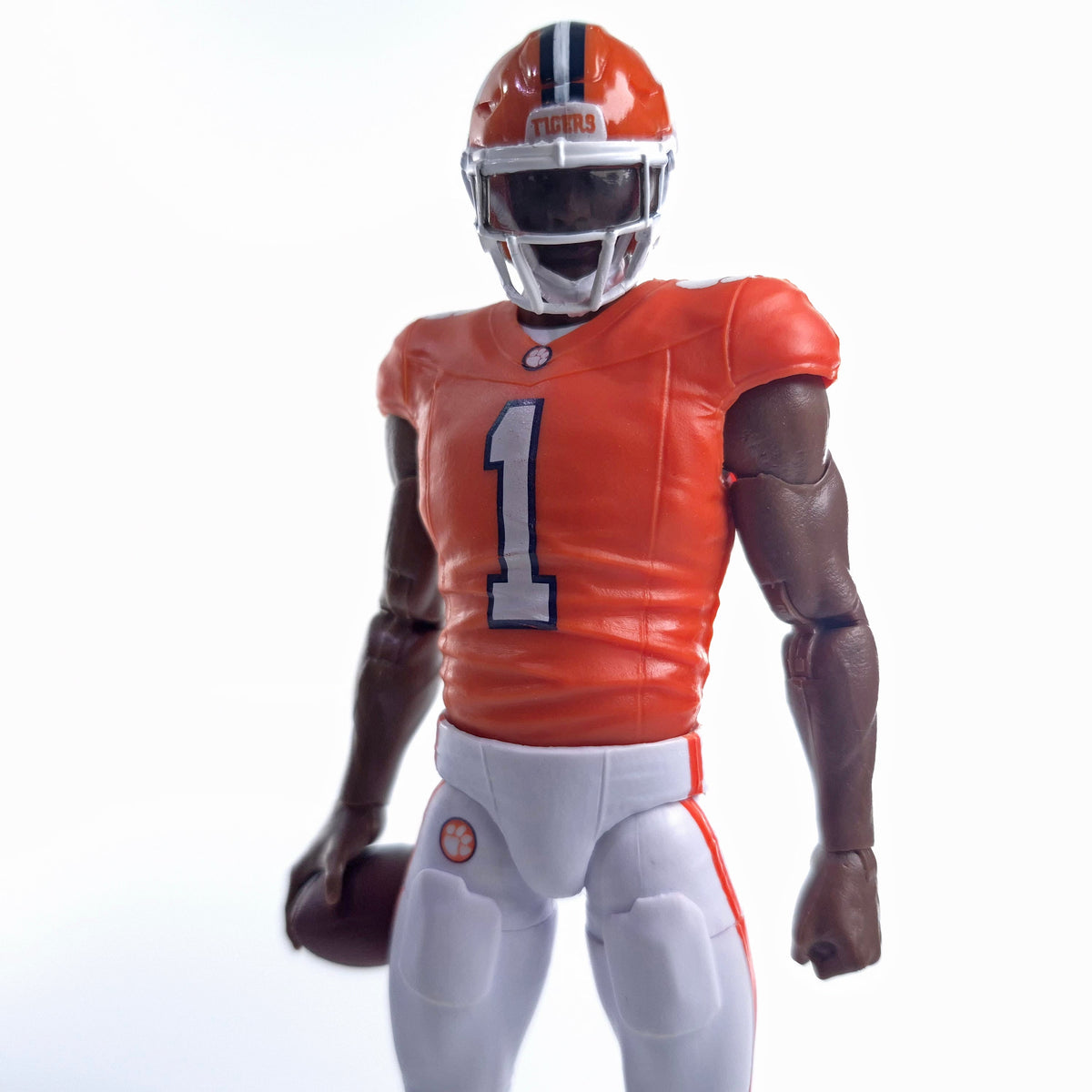 Collegiate Legends Clemson #1 football action figure in orange jersey and white pants holding a football