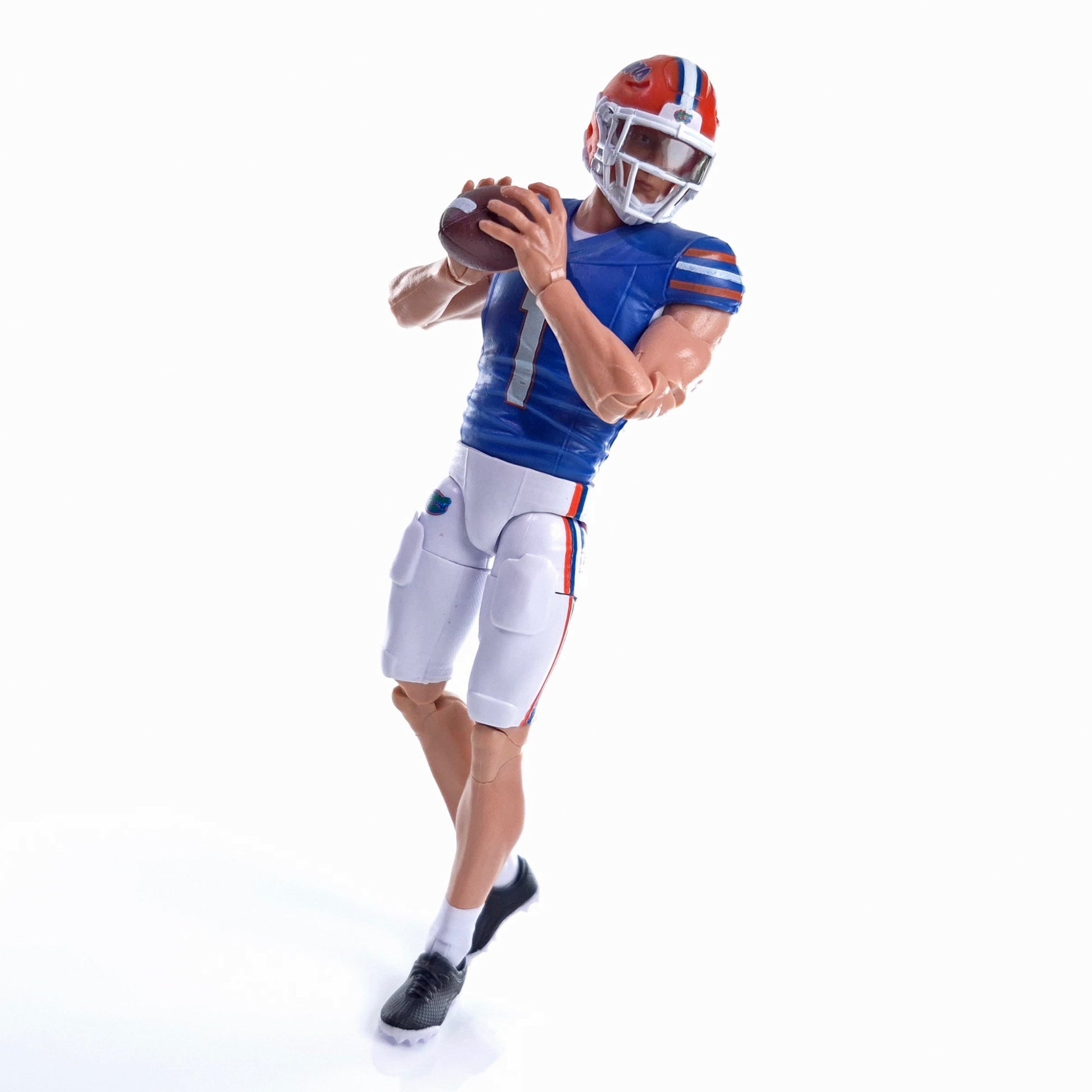 Collegiate Legends Florida football action figure in blue and orange uniform holding a football in a passing pose