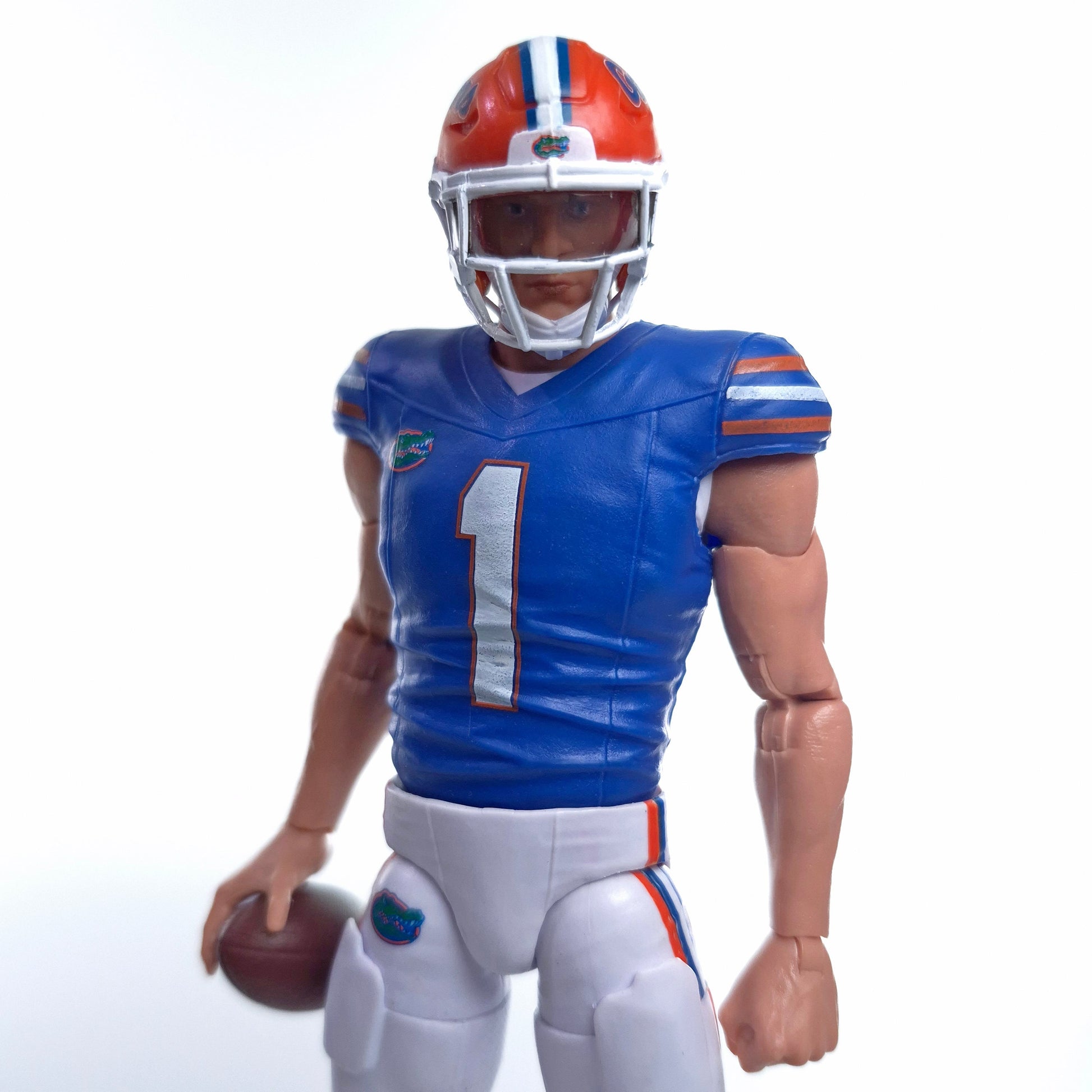 Collegiate Legends Florida Gators #1 football action figure in blue and orange uniform holding a football