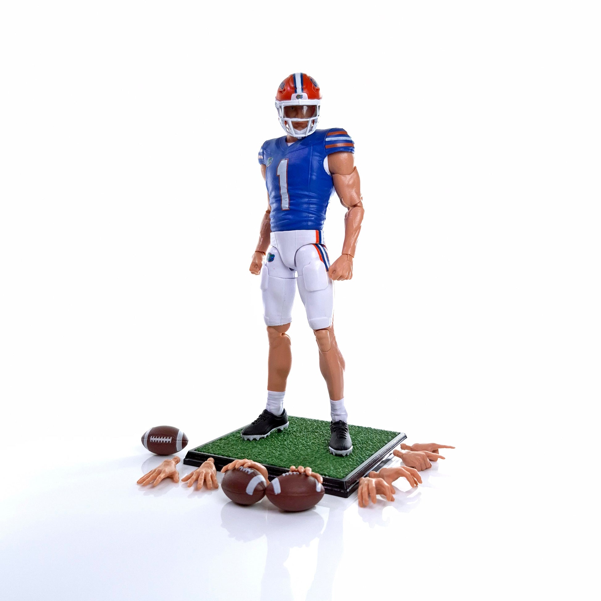 Collegiate Legends Florida Gators #1 football action figure with interchangeable hands, football, and display stand.
