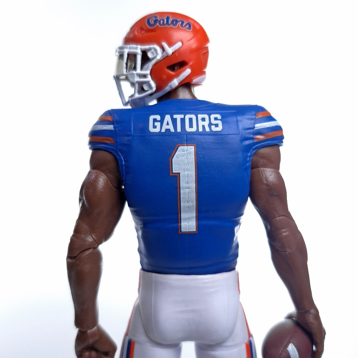 Collegiate Legends Florida Gators #1 football action figure in blue jersey and orange helmet, back view