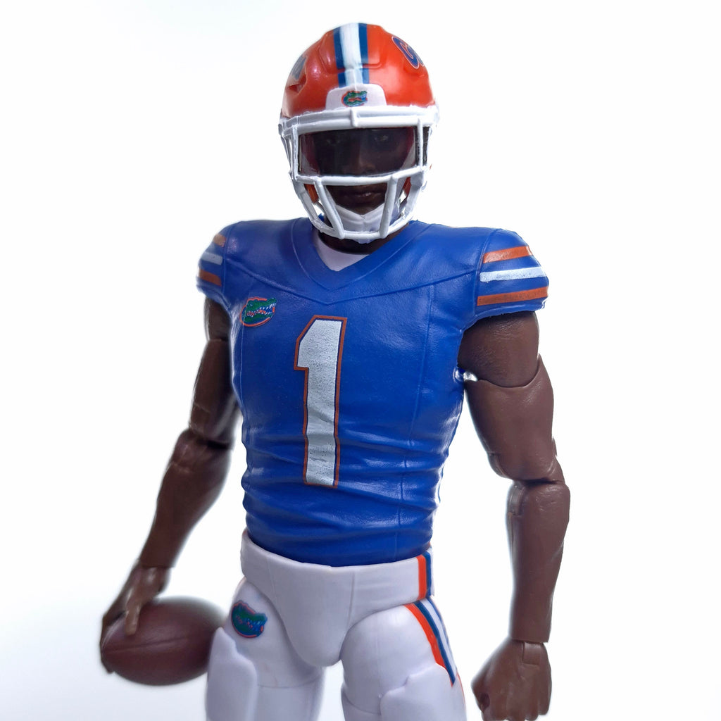 Collegiate Legends Florida Gators #1 football action figure in blue and orange uniform with helmet and football