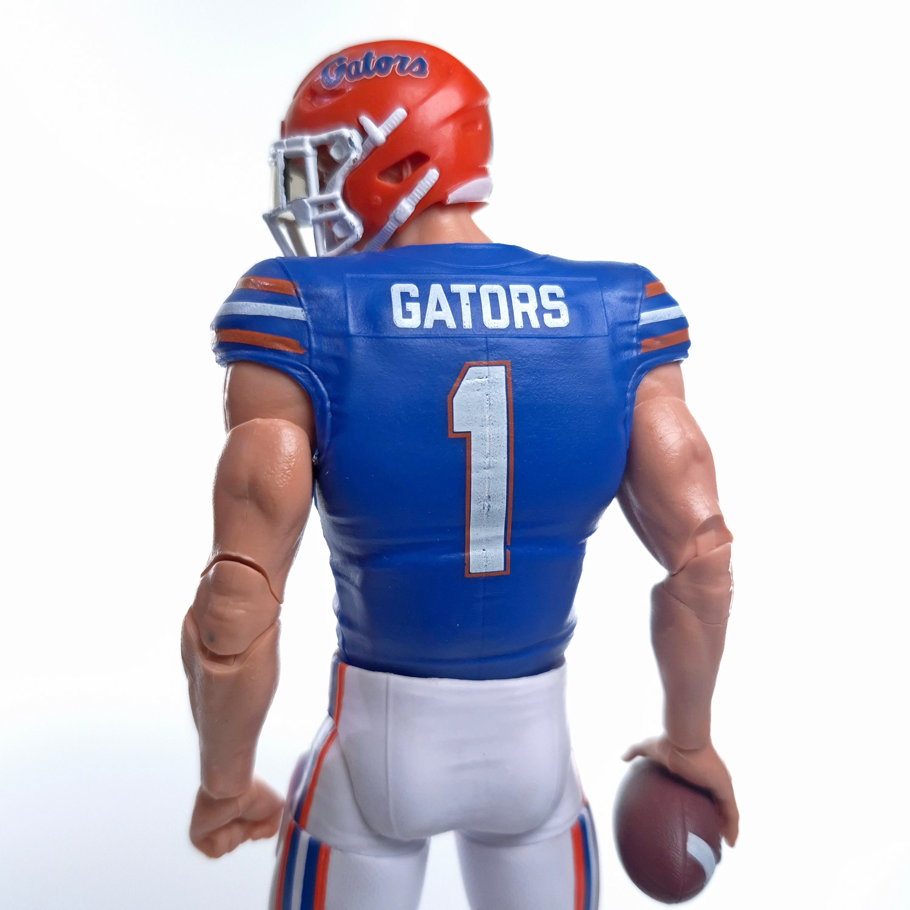 Collegiate Legends Florida Gators #1 football action figure in blue and orange jersey holding a football, back view
