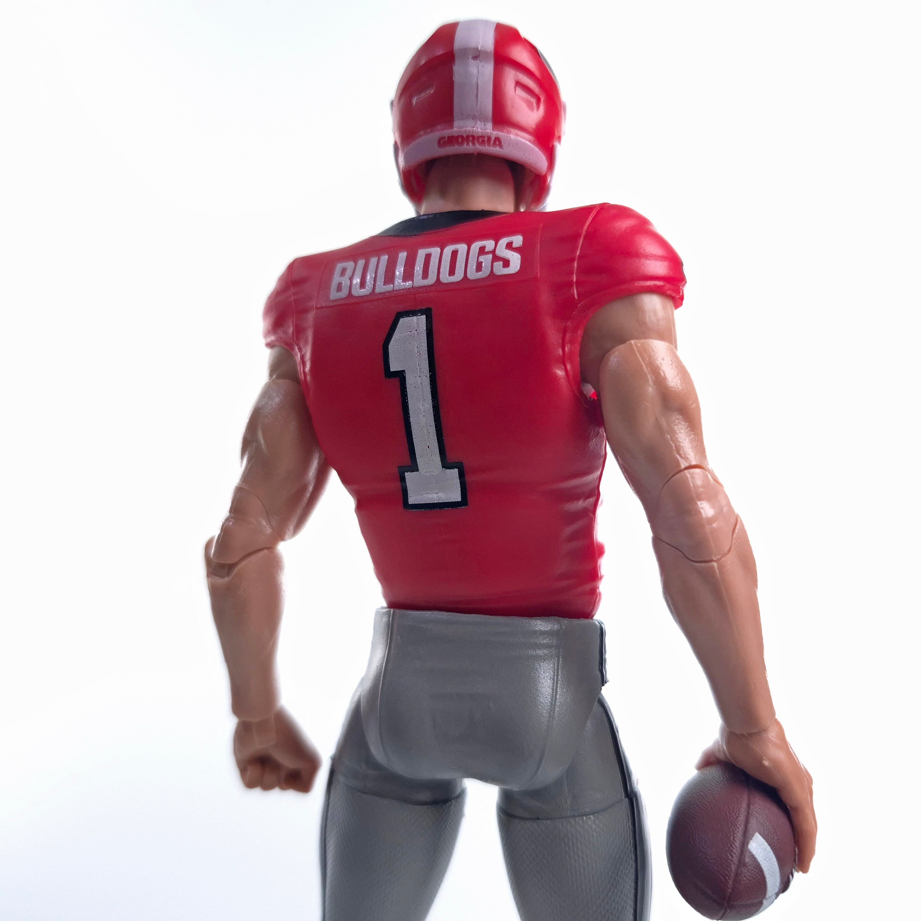 Collegiate Legends Georgia Bulldogs #1 football action figure in red jersey holding a football, back view
