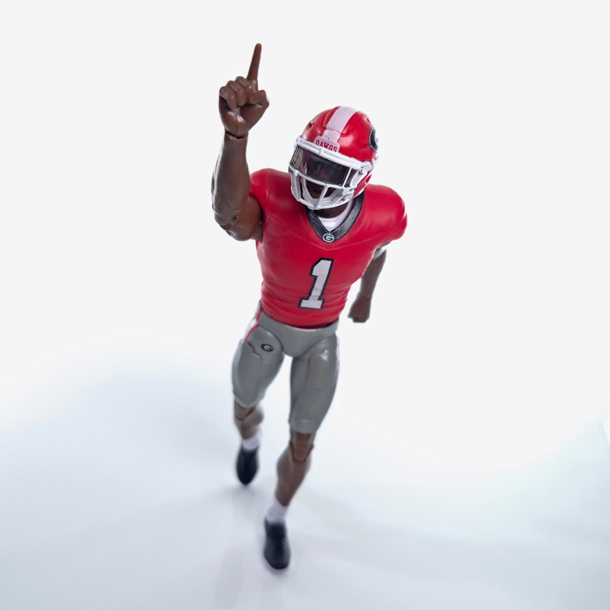 Collegiate Legends Georgia football action figure in red jersey with number 1 pointing up on a white background