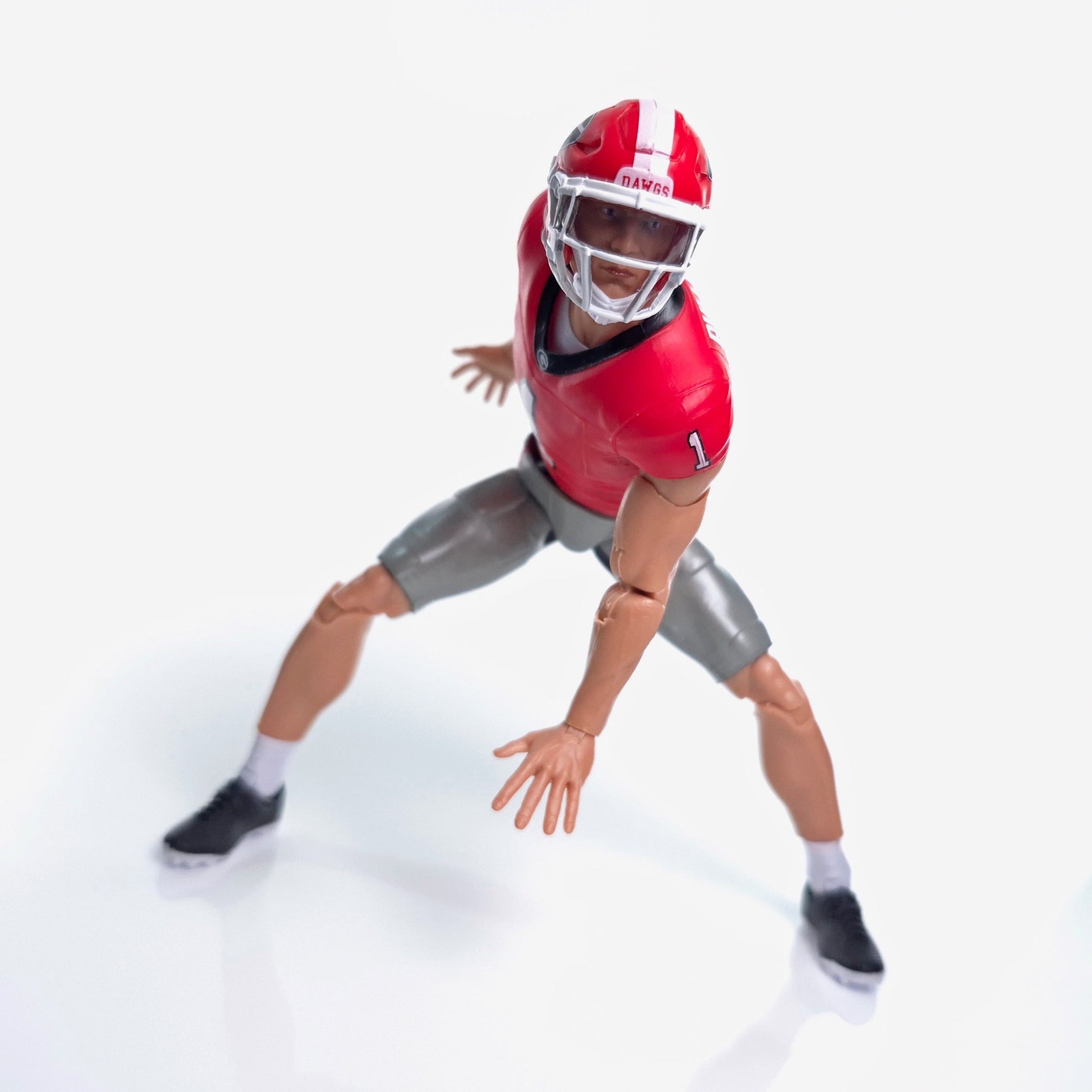Collegiate Legends Georgia football action figure in a red and black #1 jersey and helmet in a defensive stance