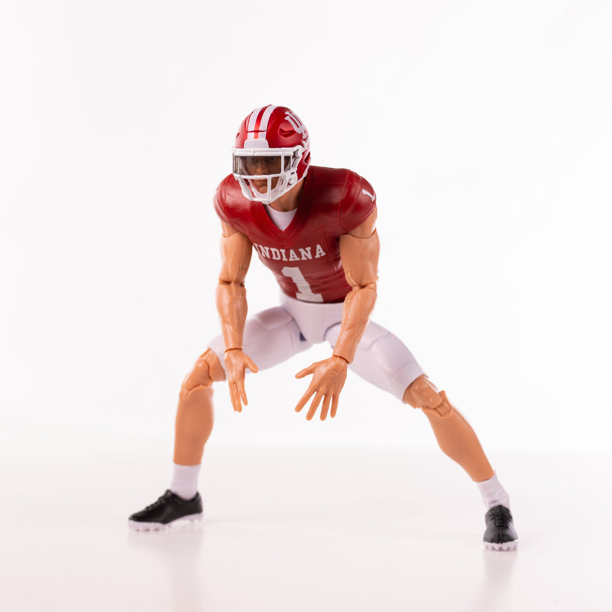 Collegiate Legends Indiana Hoosiers #1 football action figure in light skin tone posed in a dynamic stance