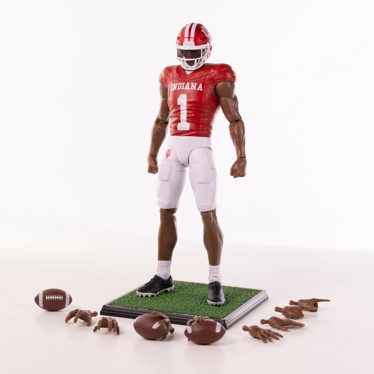 Collegiate Legends Indiana football action figure with dark skin tone, red jersey, white pants, and accessories.