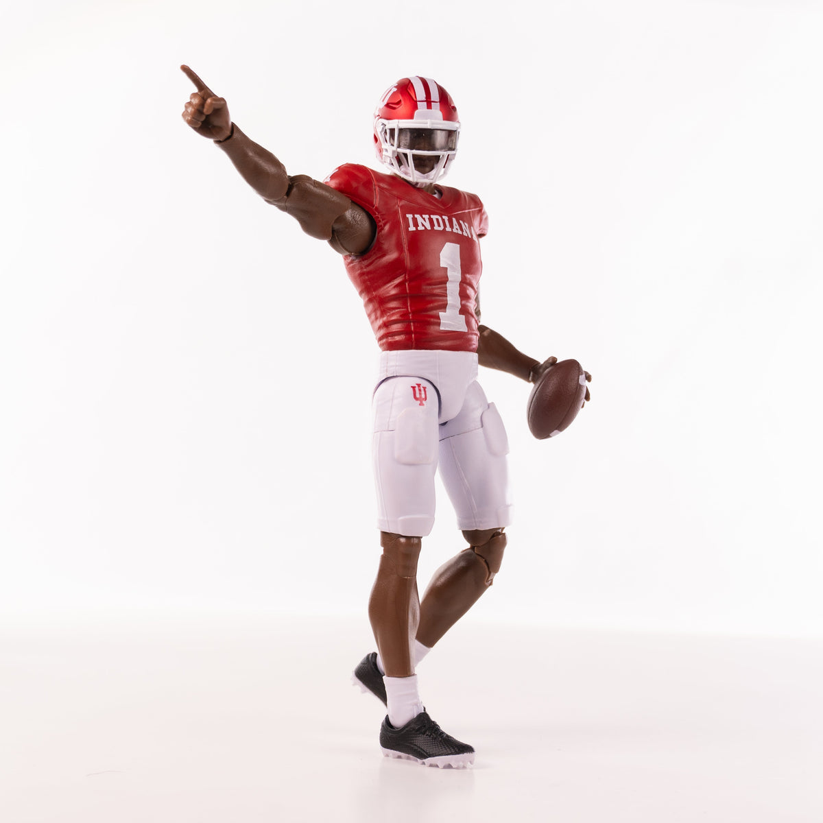 Collegiate Legends Indiana football action figure with dark skin tone, wearing red jersey and white pants with football
