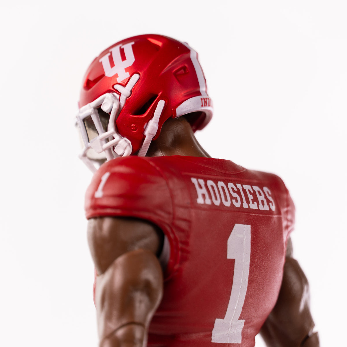 Collegiate Legends Indiana Hoosiers football action figure with dark skin tone wearing a red jersey and helmet