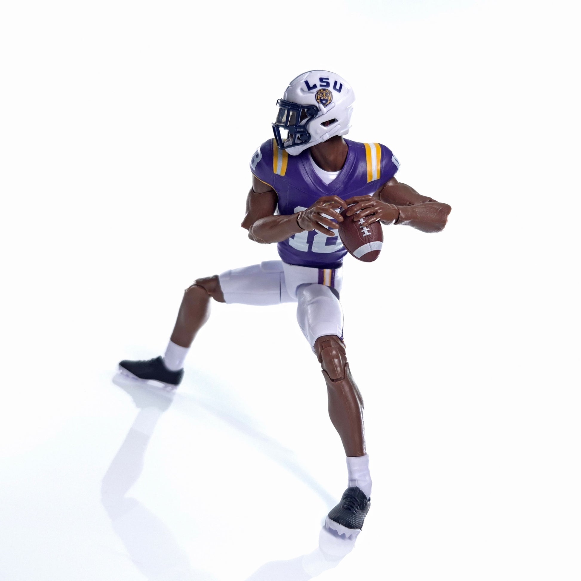 Collegiate Legends LSU football action figure in purple and gold uniform holding a football in a dynamic pose