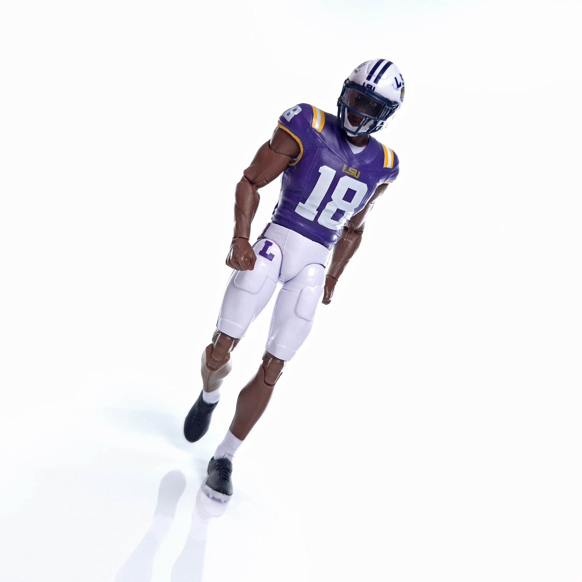 Collegiate Legends LSU #18 football action figure in purple and gold uniform with helmet on a white background