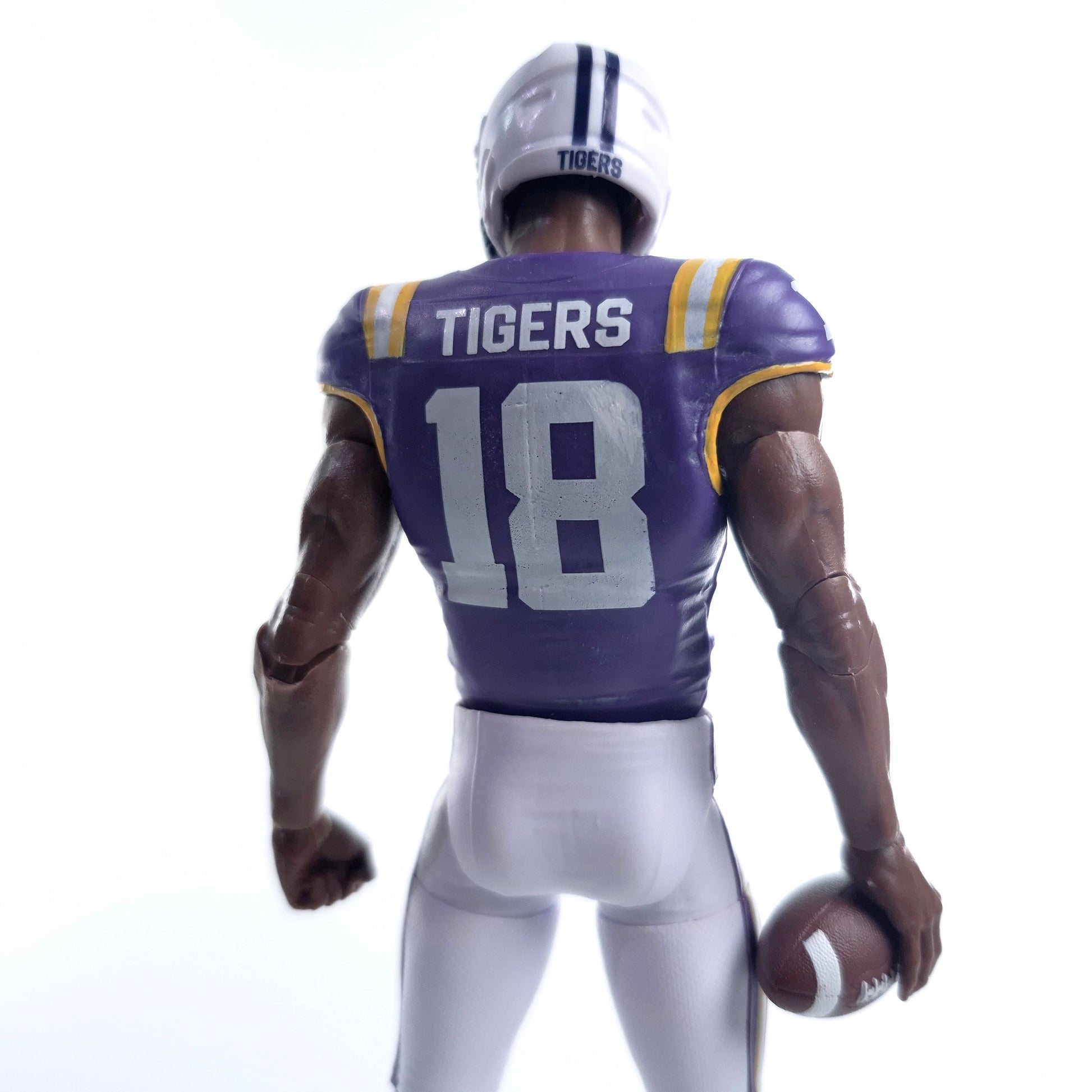 Collegiate Legends #18 LSU football action figure in purple and gold uniform, back view holding a football