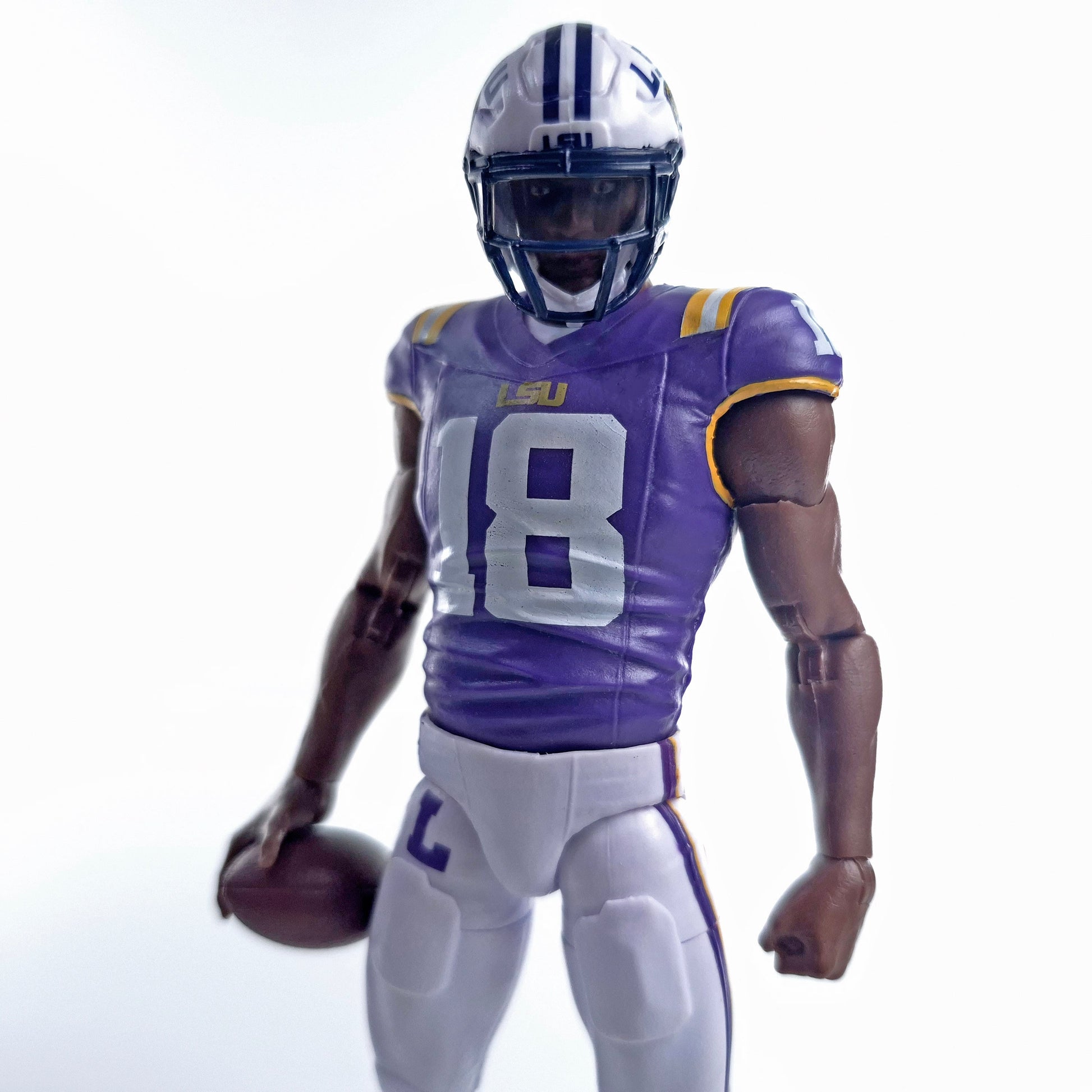 Collegiate Legends LSU #18 football action figure in purple and gold uniform holding a football on white background