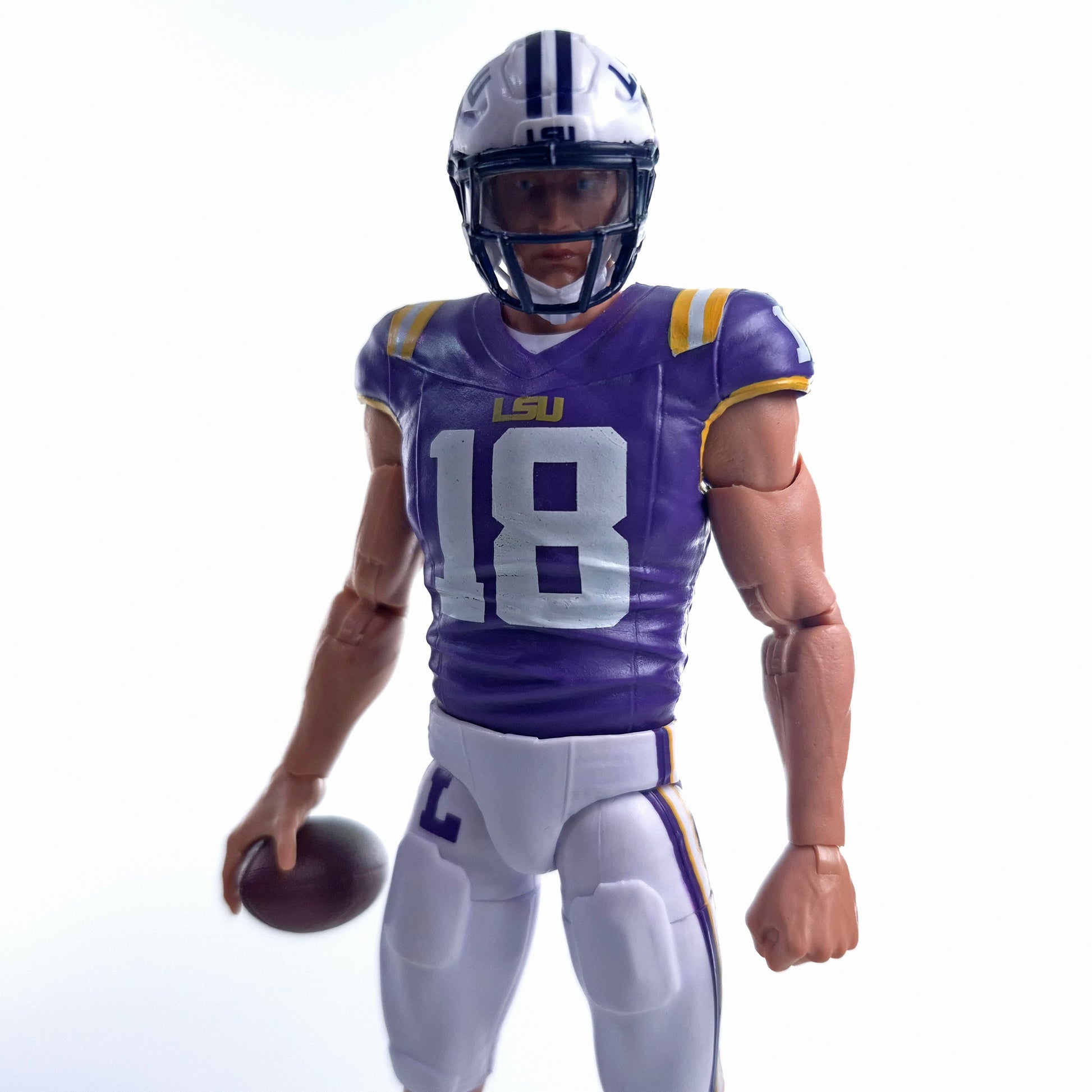 Collegiate Legends #18 LSU football action figure in purple and gold uniform holding a football