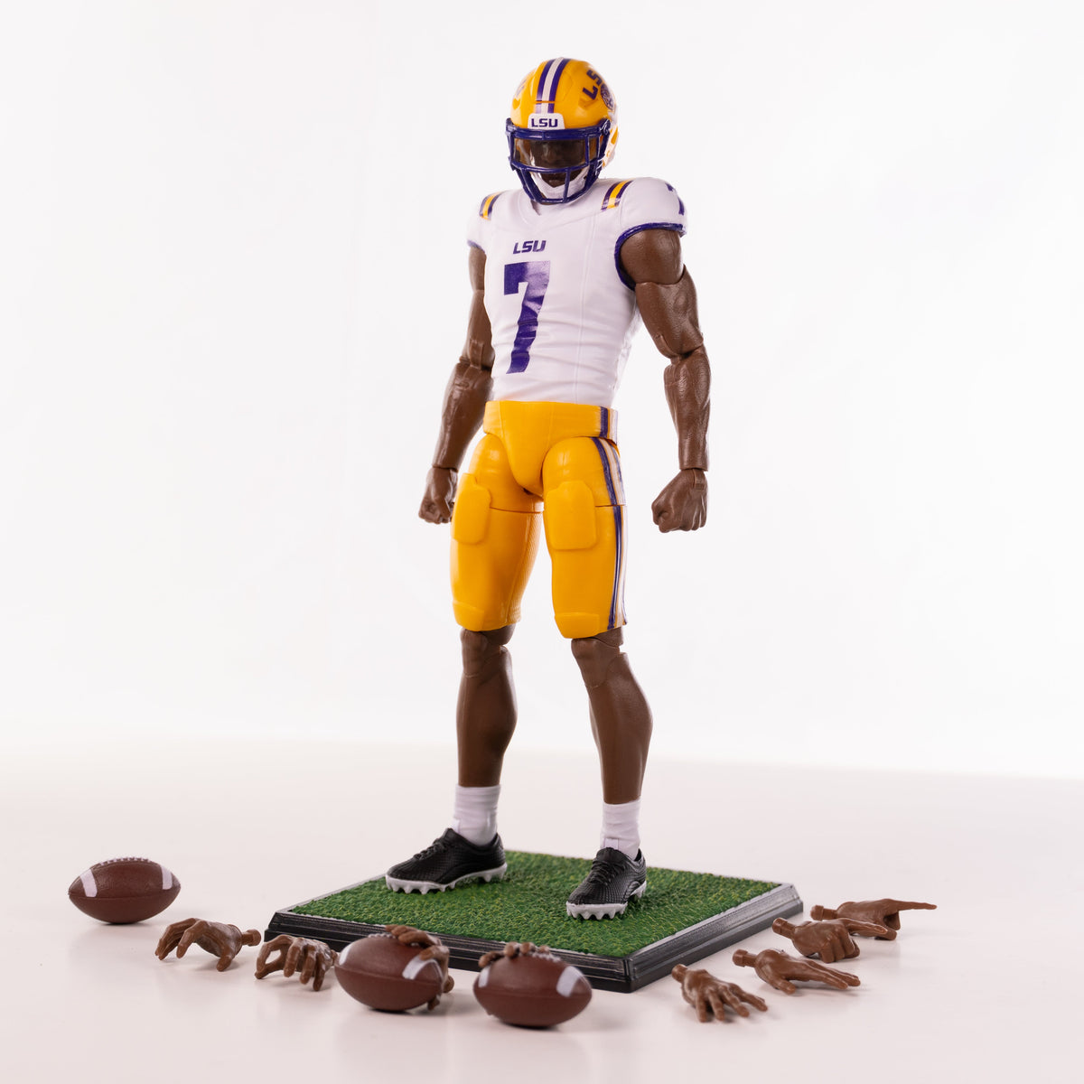 Collegiate Legends LSU #7 football action figure in white and yellow uniform with display stand and accessories