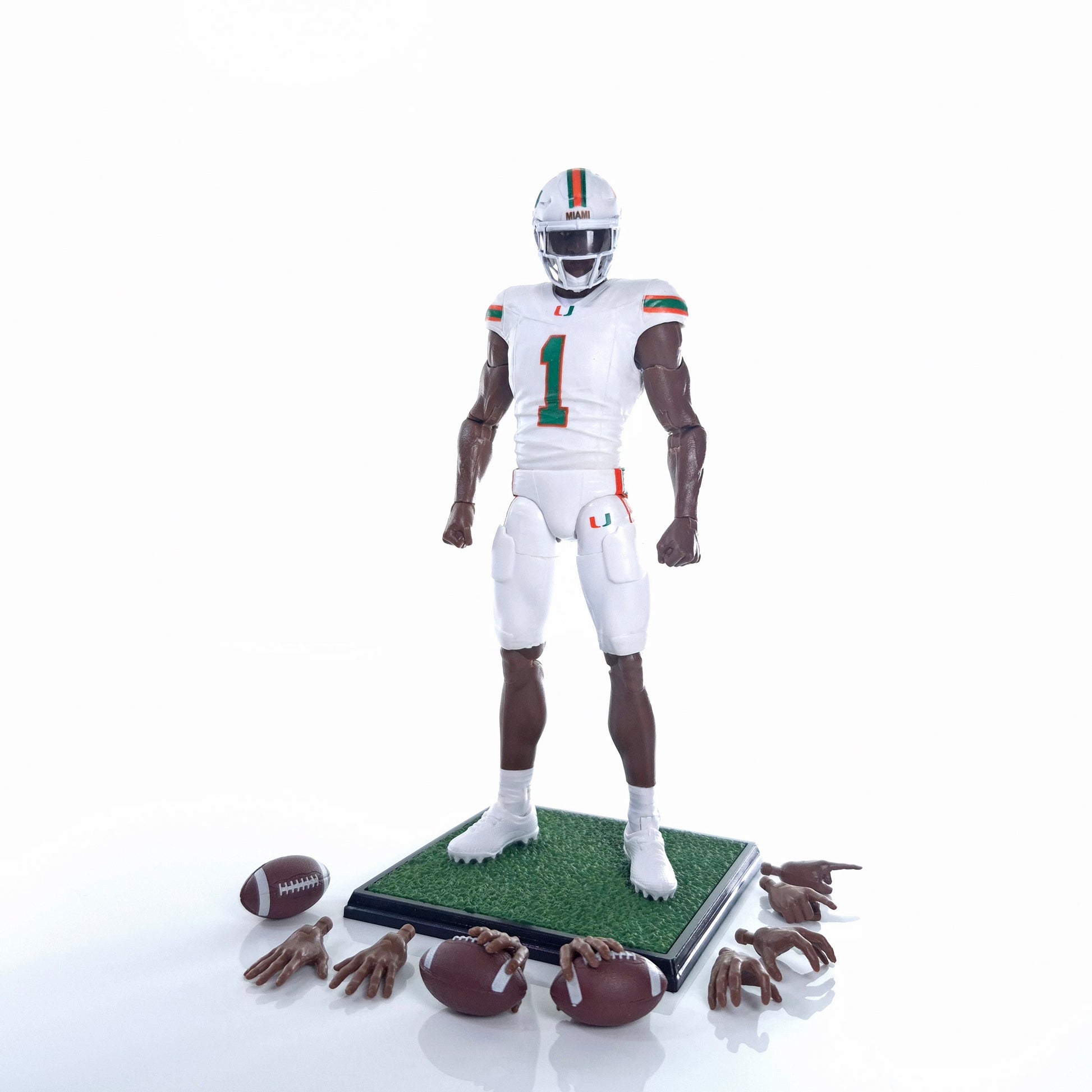 Collegiate Legends Miami Hurricanes #1 football action figure with display stand, footballs, and interchangeable hands.