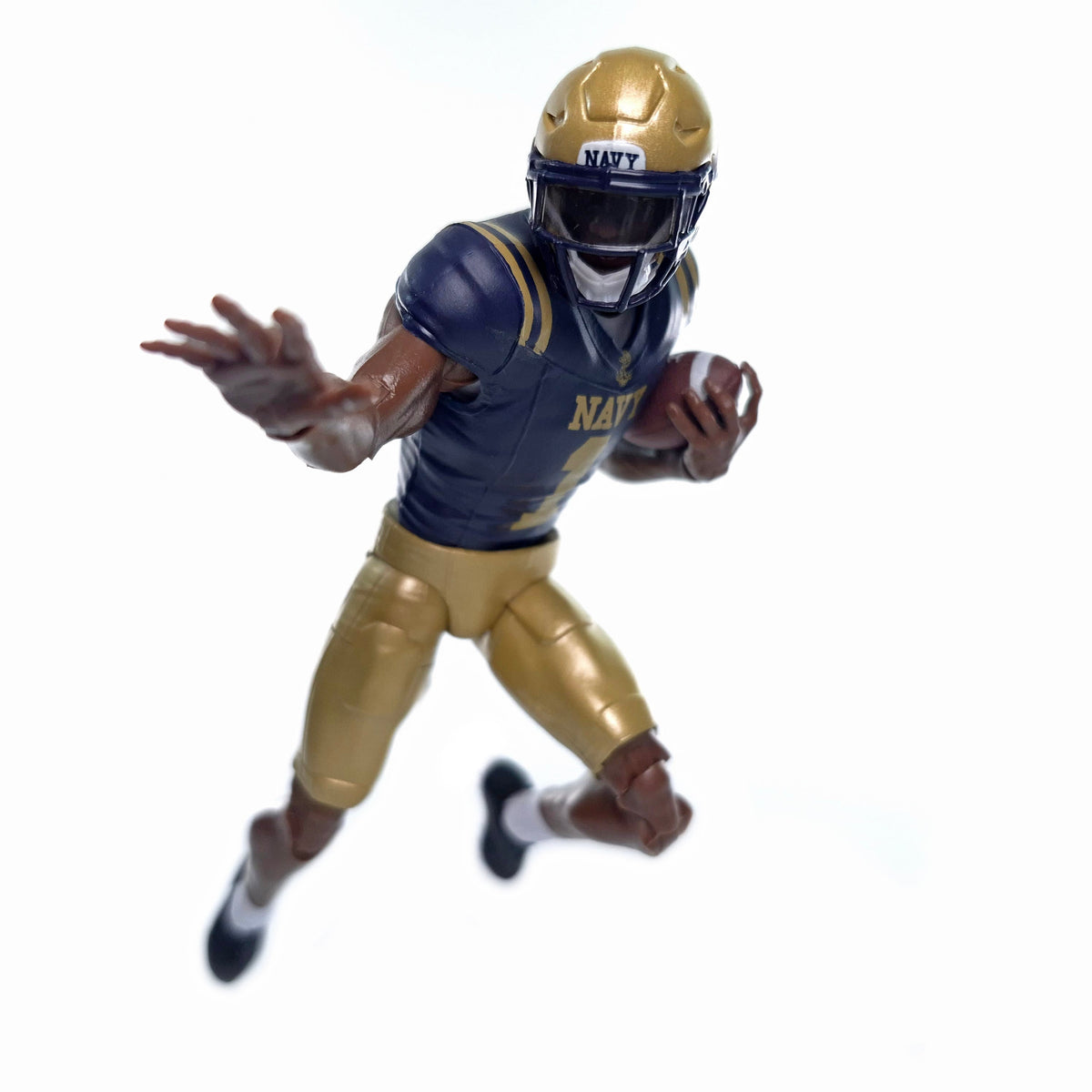 Collegiate Legends Navy football player action figure in a dynamic running pose with a gold helmet and blue jersey.