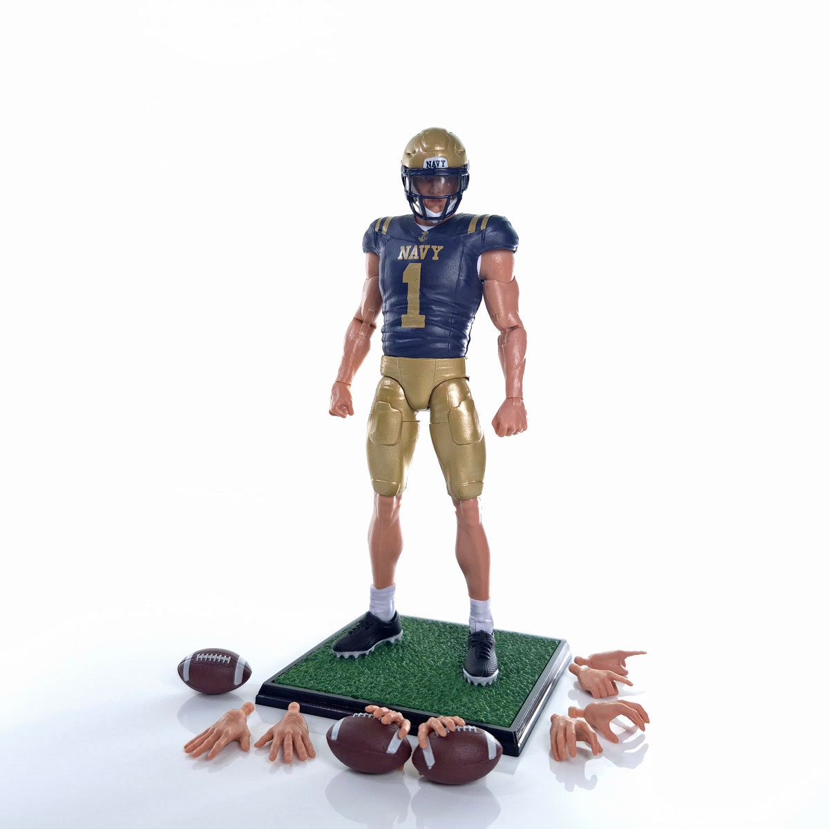 Collegiate Legends Navy football action figure wearing #1 blue and gold uniform with display stand and accessories