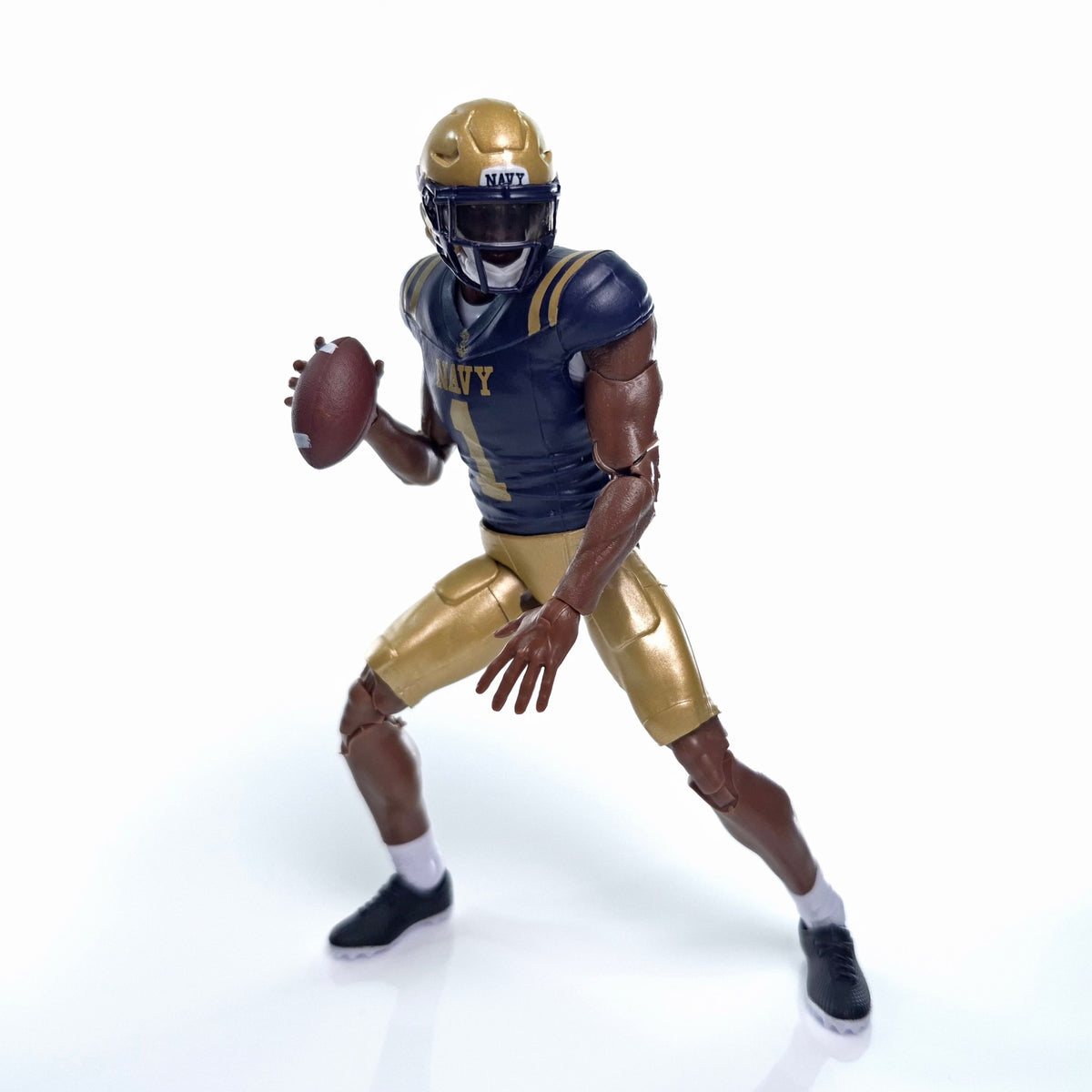 Collegiate Legends Navy football action figure in dark blue and gold uniform with number 1 jersey and football accessory