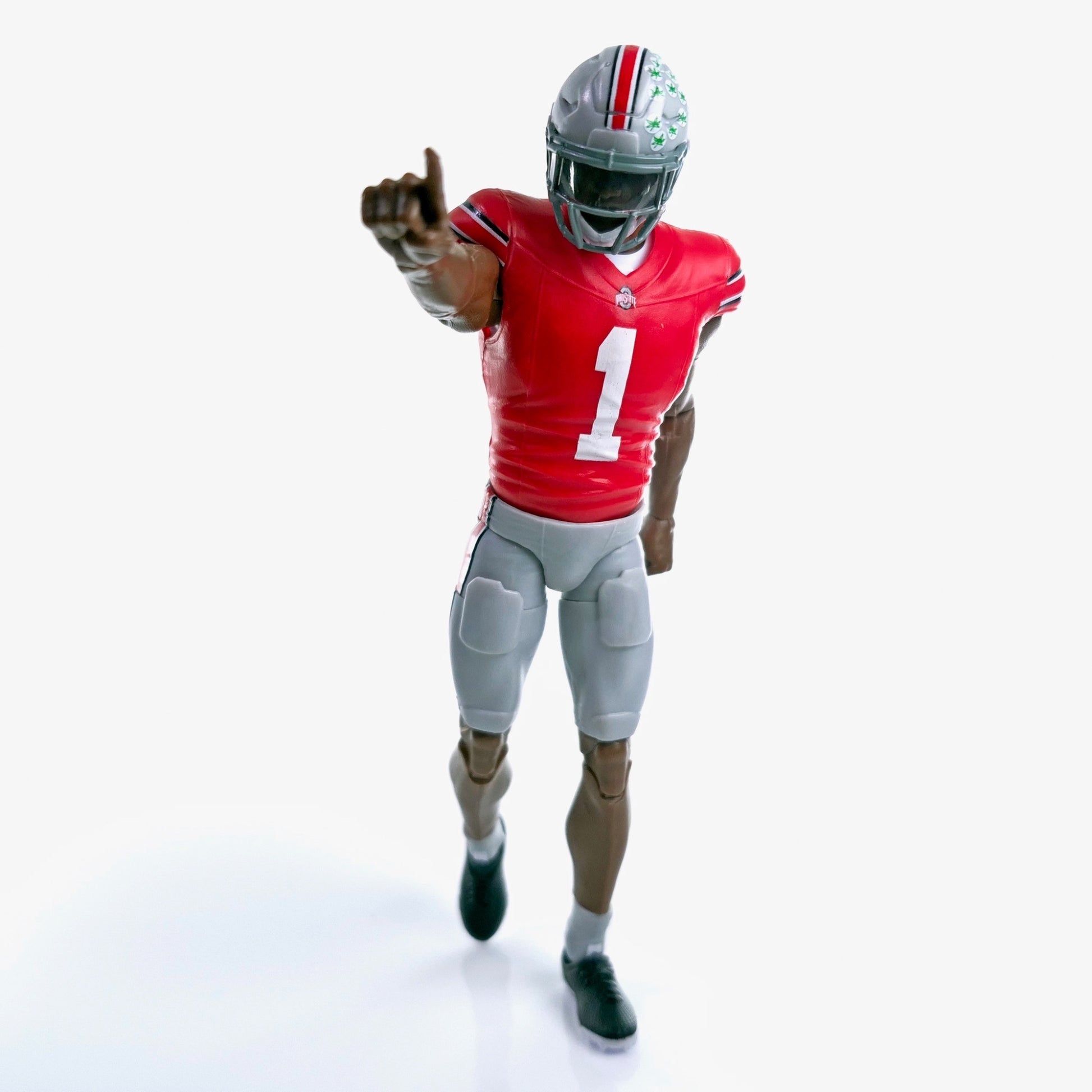 Collegiate Legends Ohio State #1 football action figure in a scarlet jersey and gray pants pointing forward