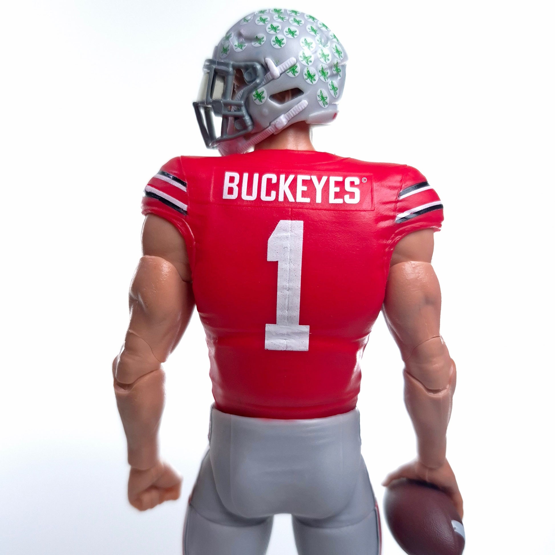 Collegiate Legends Ohio State #1 football action figure in scarlet and gray uniform, rear view with helmet detail.