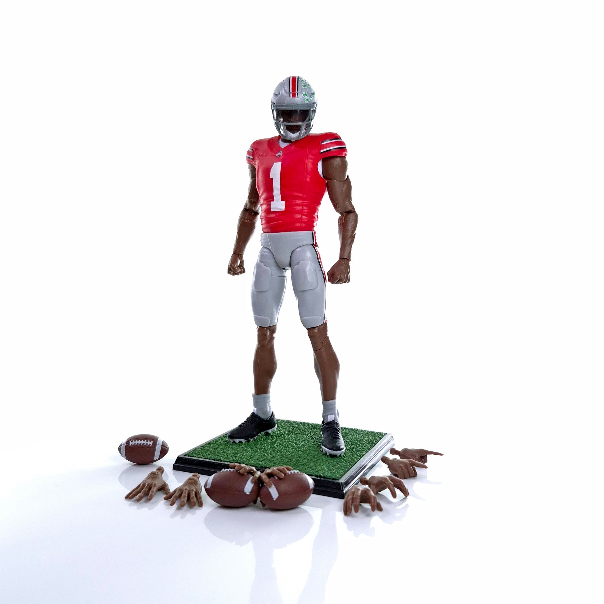 Collegiate Legends Ohio State #1 football action figure in scarlet and gray uniform with display stand and accessories.
