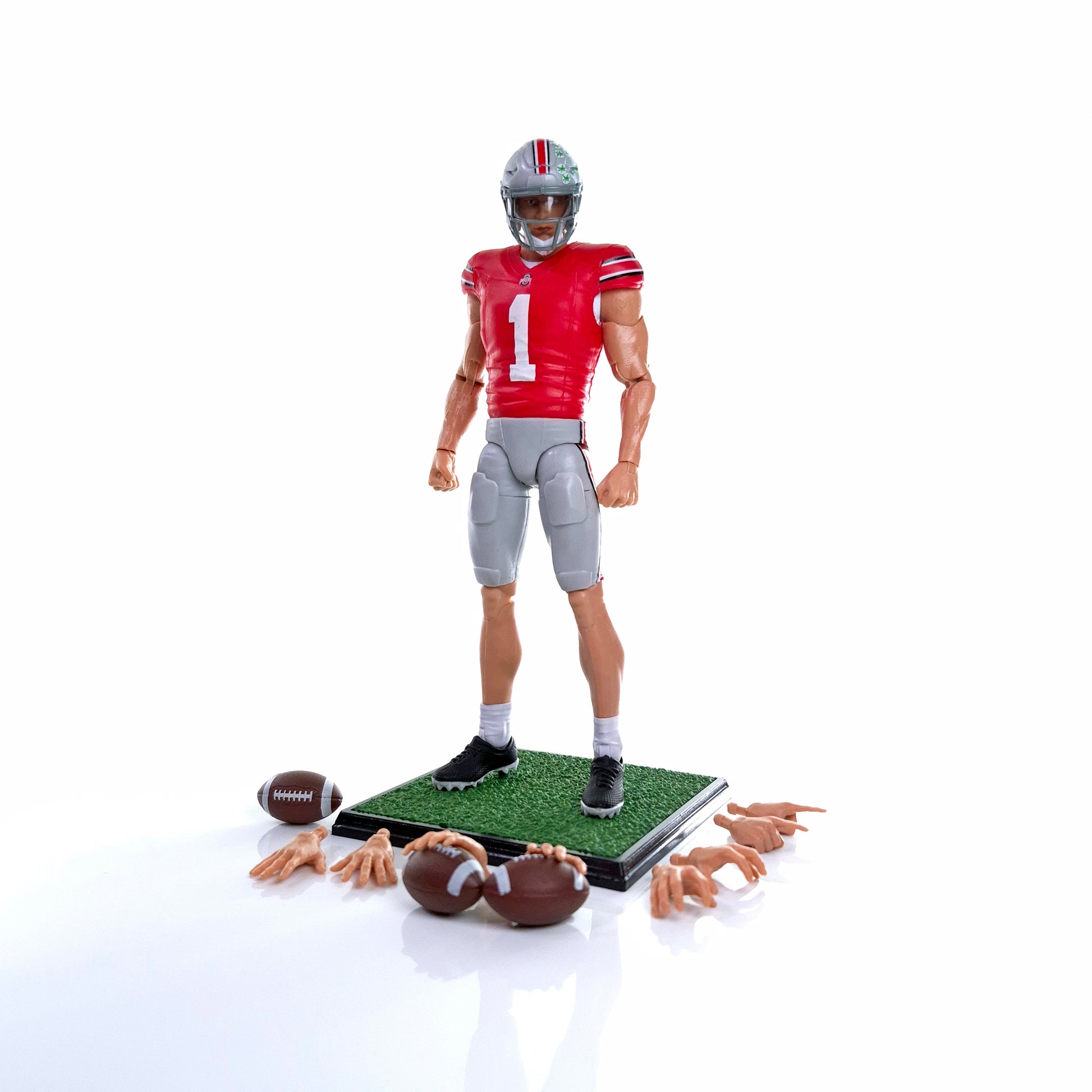 Collegiate Legends Ohio State #1 football action figure in scarlet and gray uniform with display stand and accessories.