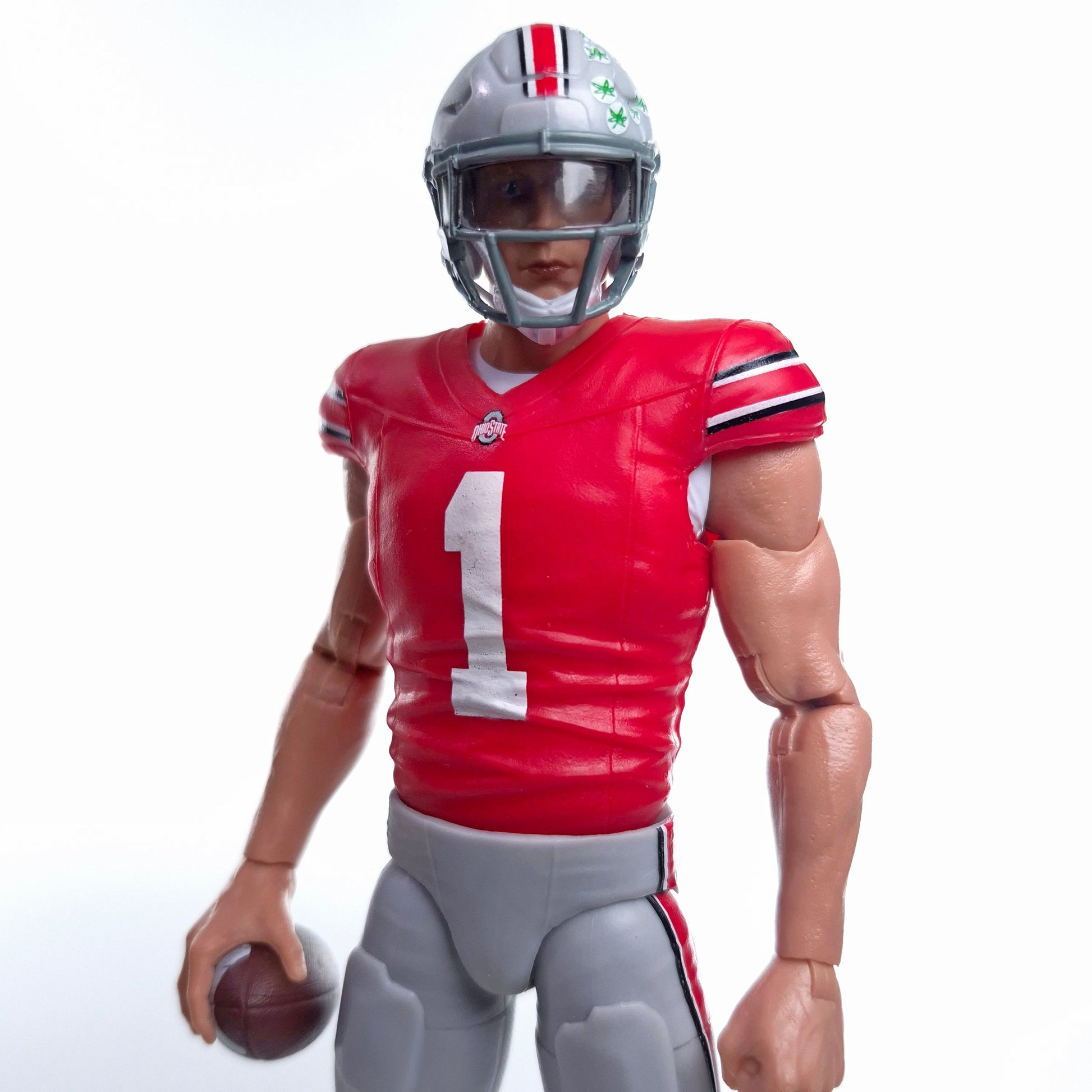 Collegiate Legends Ohio State football action figure wearing a scarlet and gray #1 jersey and holding a football