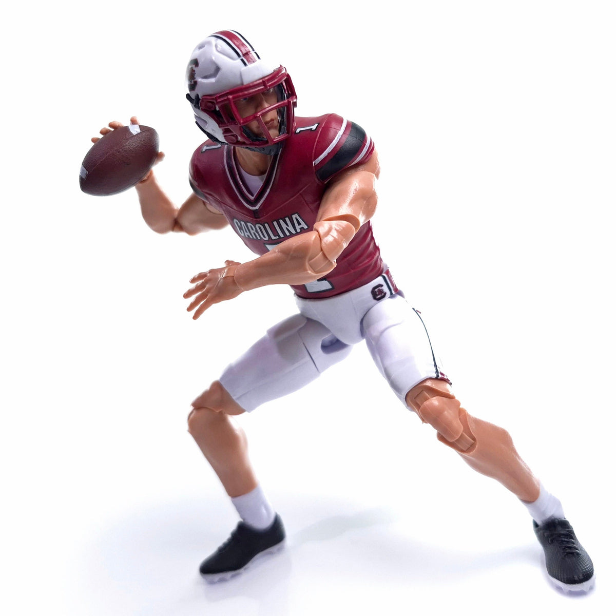 Collegiate Legends South Carolina football action figure in garnet and black #1 jersey throwing a football