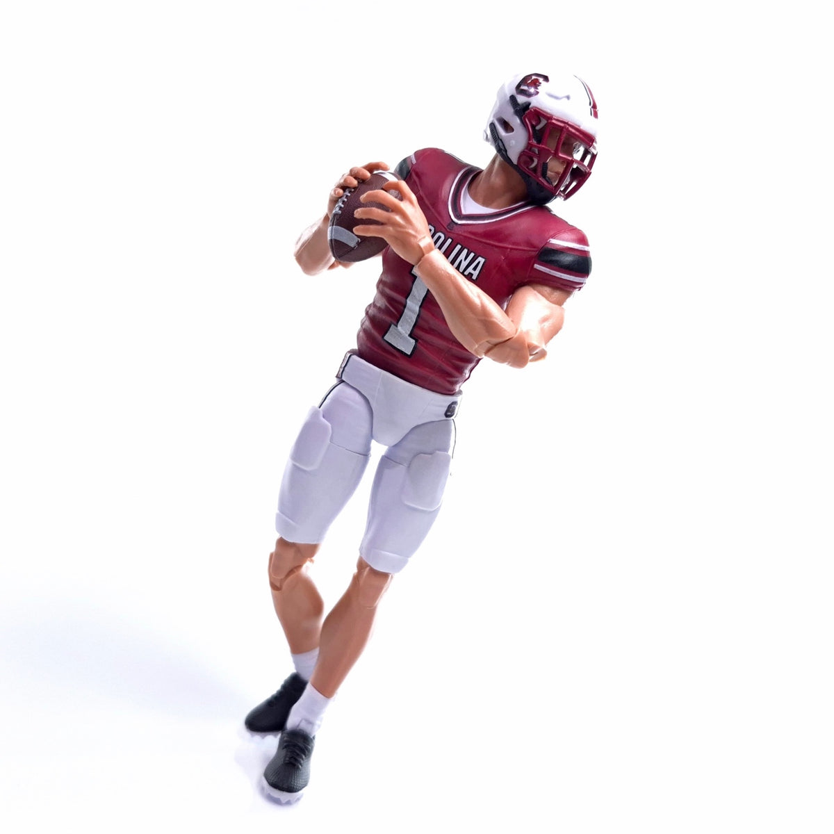 Collegiate Legends South Carolina football action figure wearing a garnet and black #1 jersey holding a football