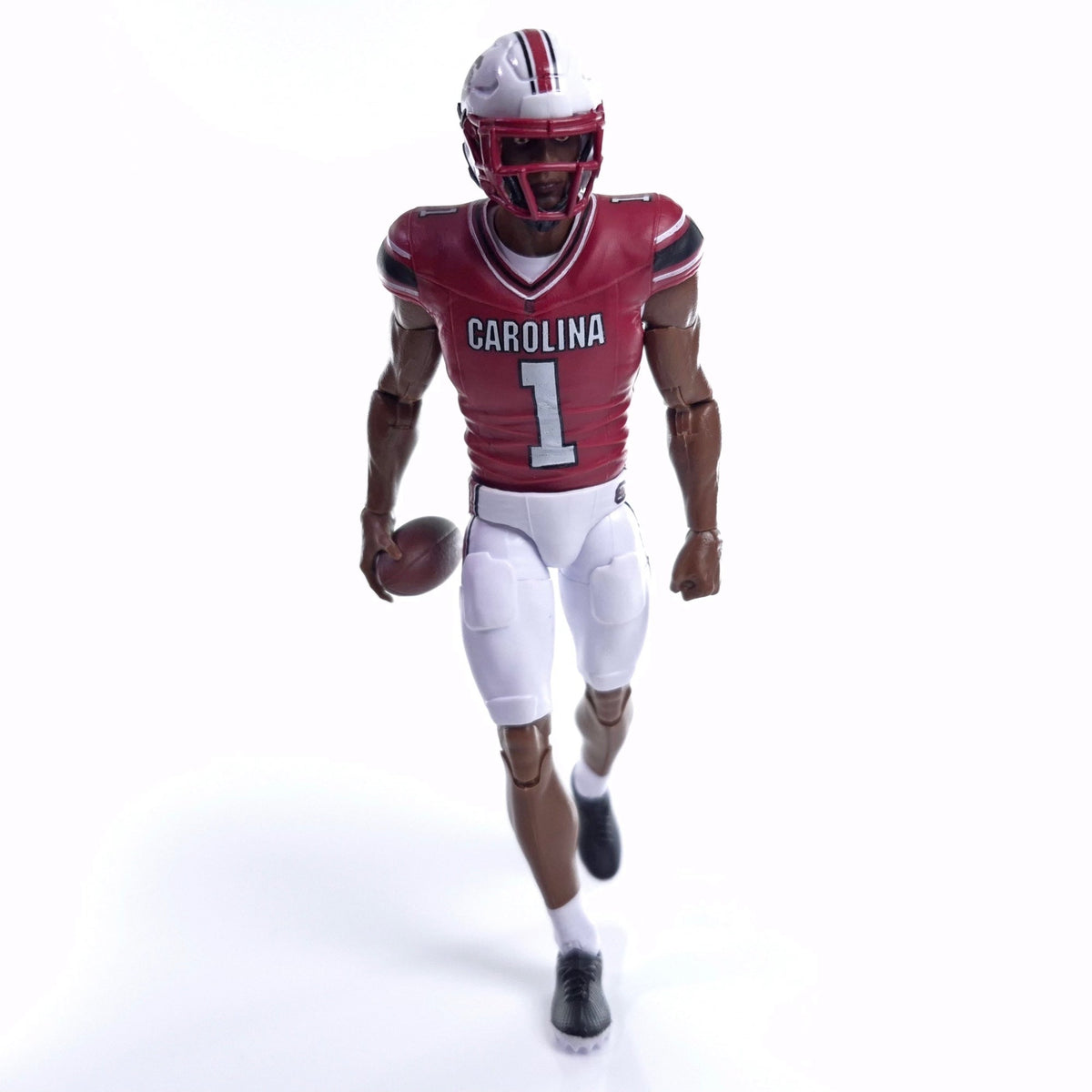 Collegiate Legends South Carolina football action figure wearing a garnet and white #1 jersey and holding a football