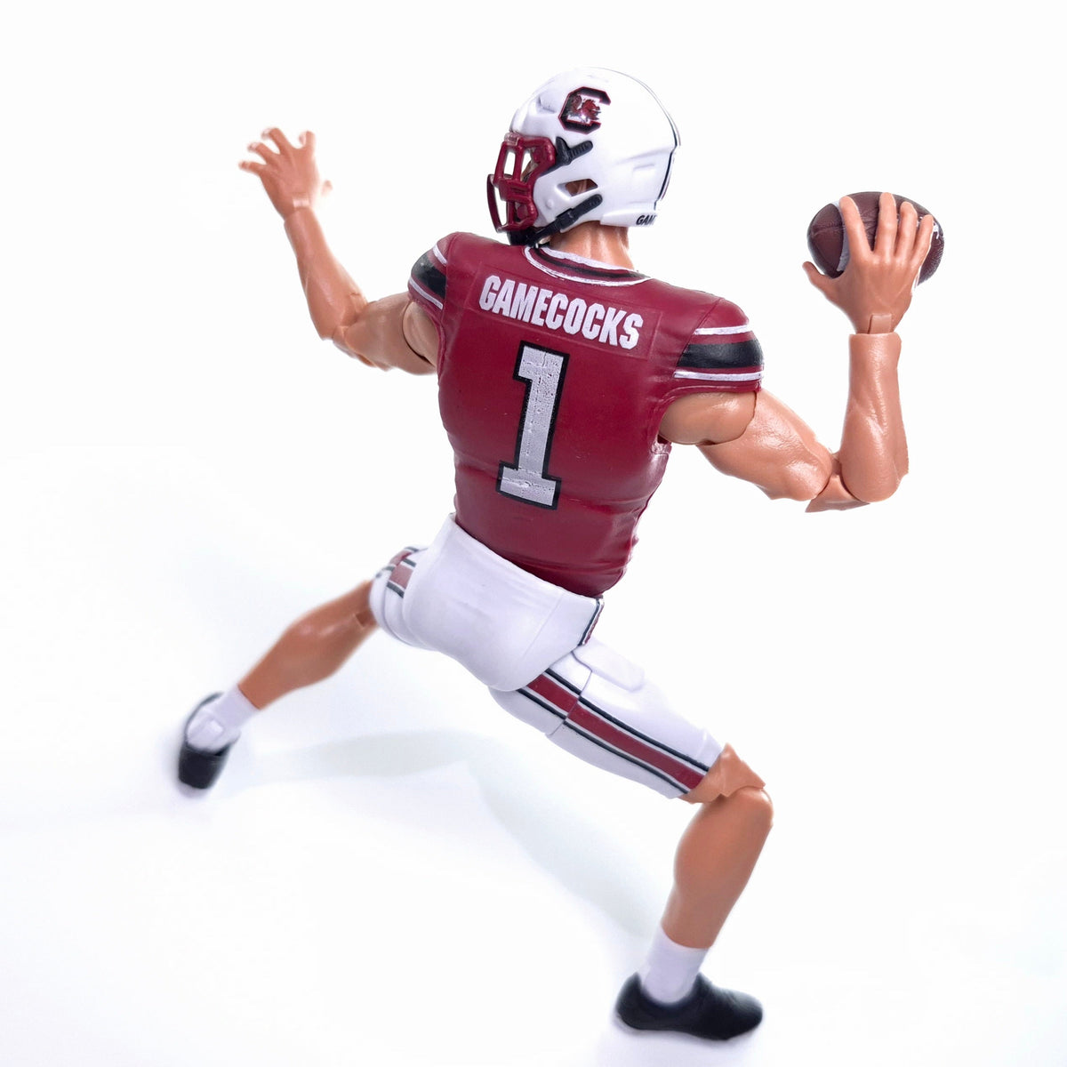 Collegiate Legends South Carolina Gamecocks #1 football action figure in a throwing pose with garnet and white uniform