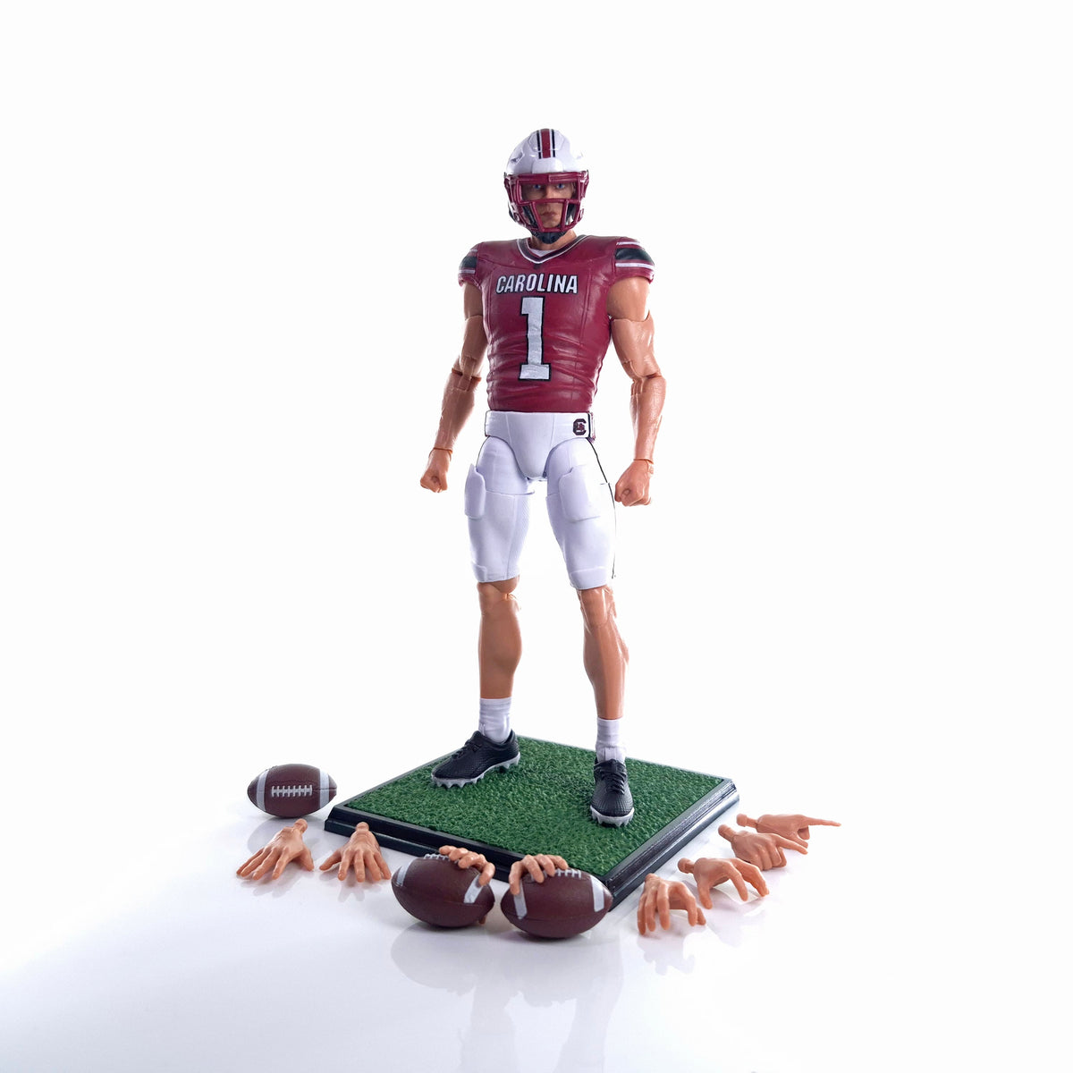 Collegiate Legends South Carolina football action figure with #1 jersey, display stand, footballs, and hand sets.