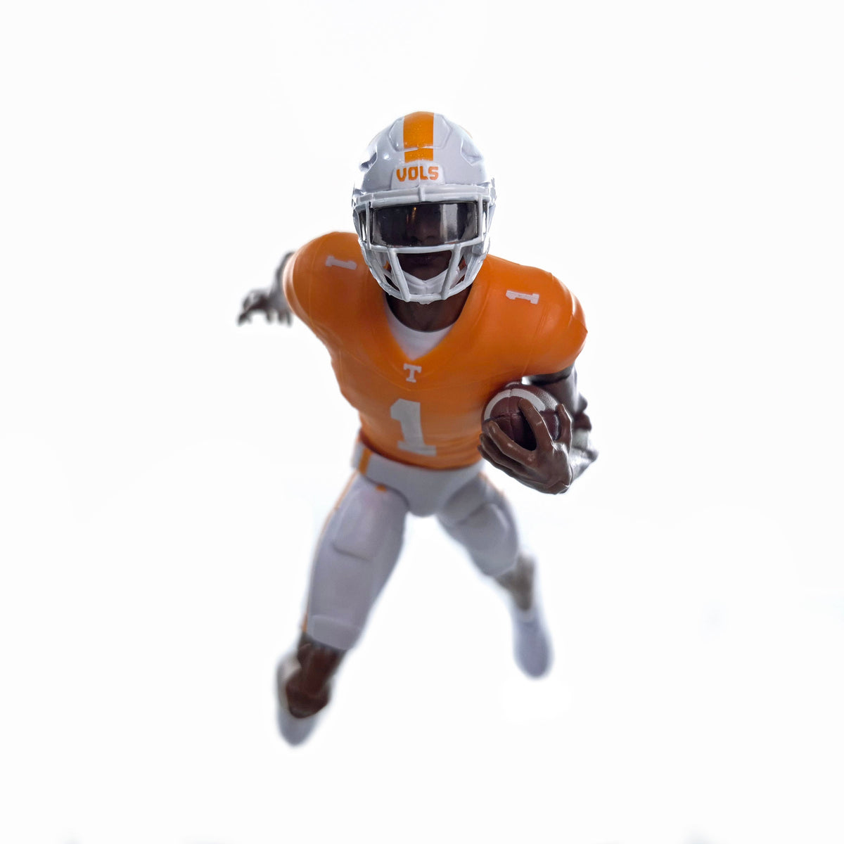 Collegiate Legends Tennessee football action figure in orange and white uniform running with a football