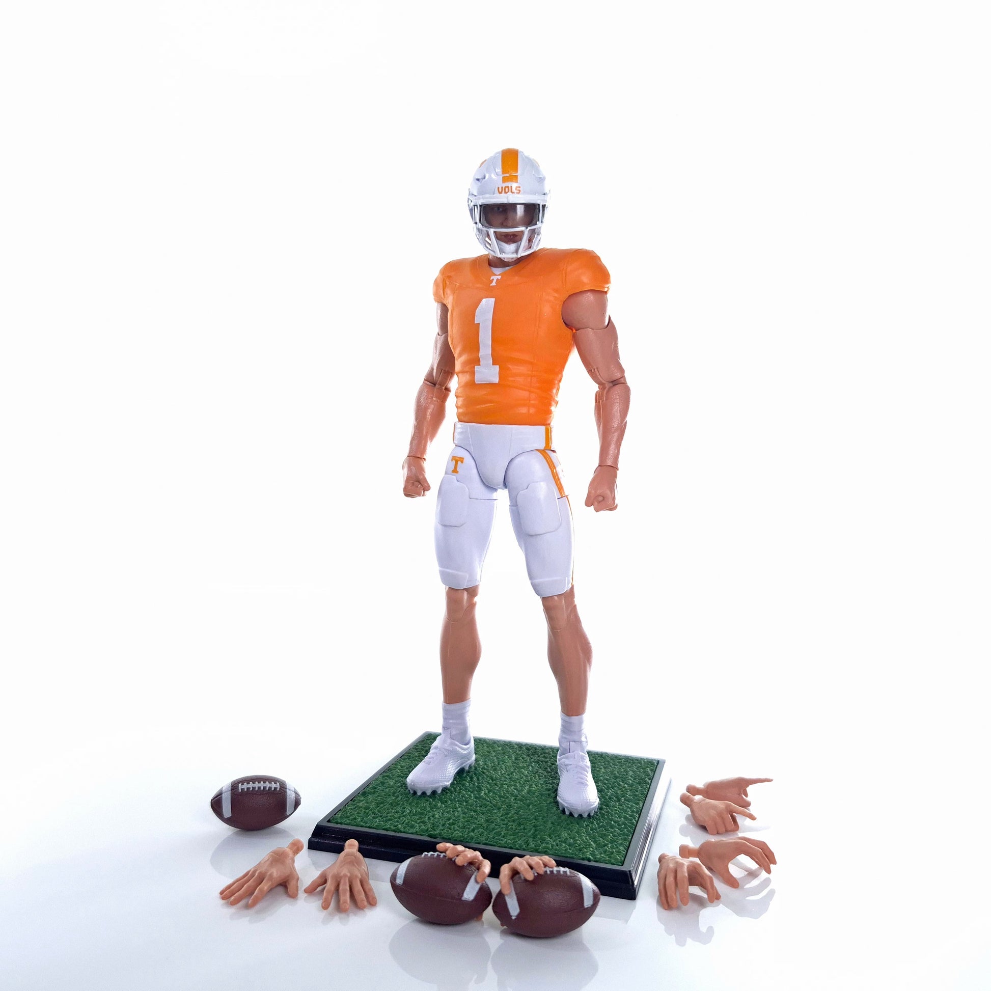 Collegiate Legends Tennessee football action figure in orange and white uniform with display stand and accessories.