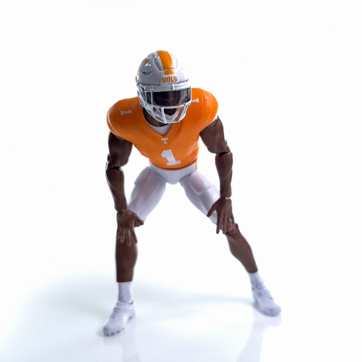 Collegiate Legends Tennessee football action figure in orange and white #1 jersey posed in a ready stance