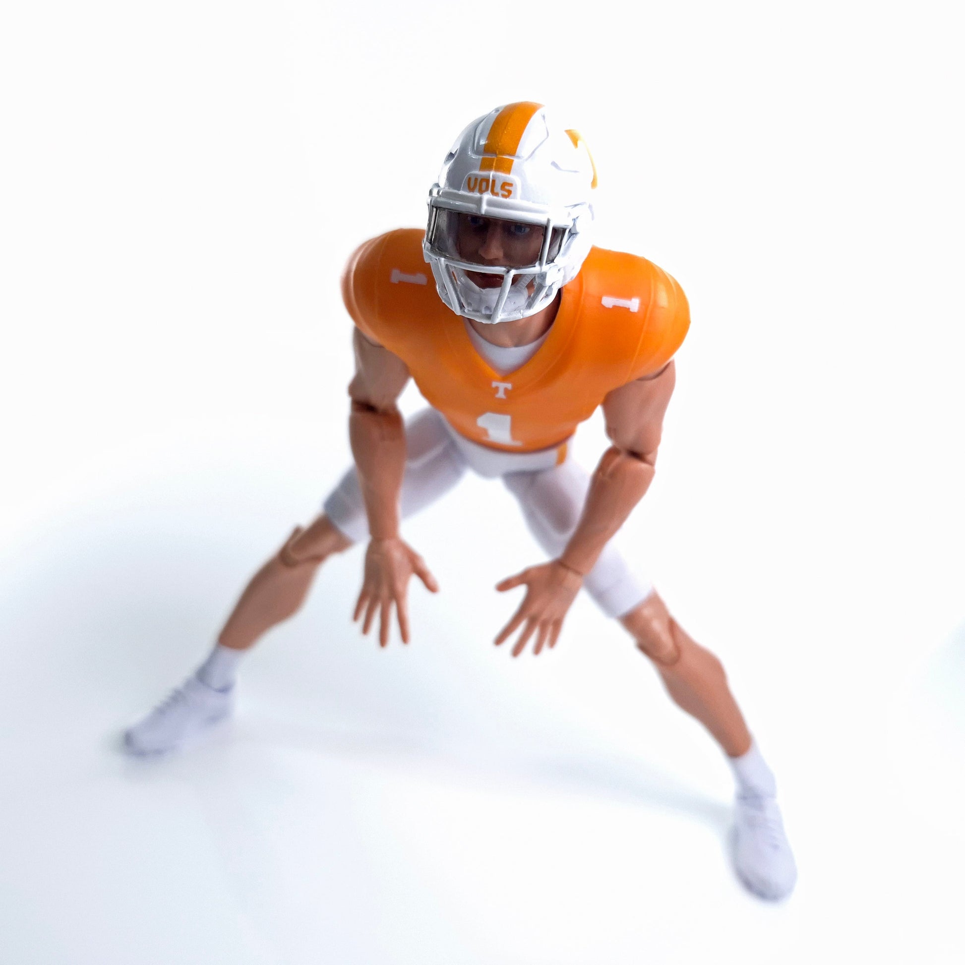 Collegiate Legends Tennessee football action figure in orange and white uniform with number 1 jersey in athletic pose