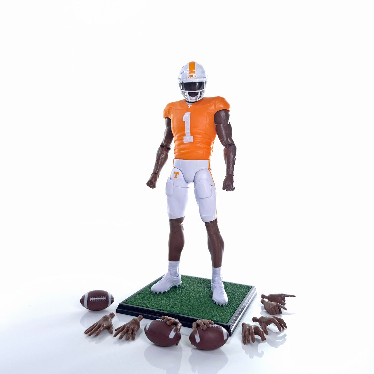 Collegiate Legends Tennessee football action figure in orange and white uniform with display stand and accessories.